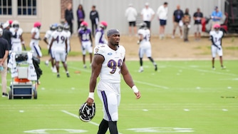 Baltimore Ravens linebacker Odafe Oweh (99) crosses a practice field to join teammates during the team’s training camp at the Under Armour Performance Center in Owings Mills, Md. on Tuesday, August 19, 2025.