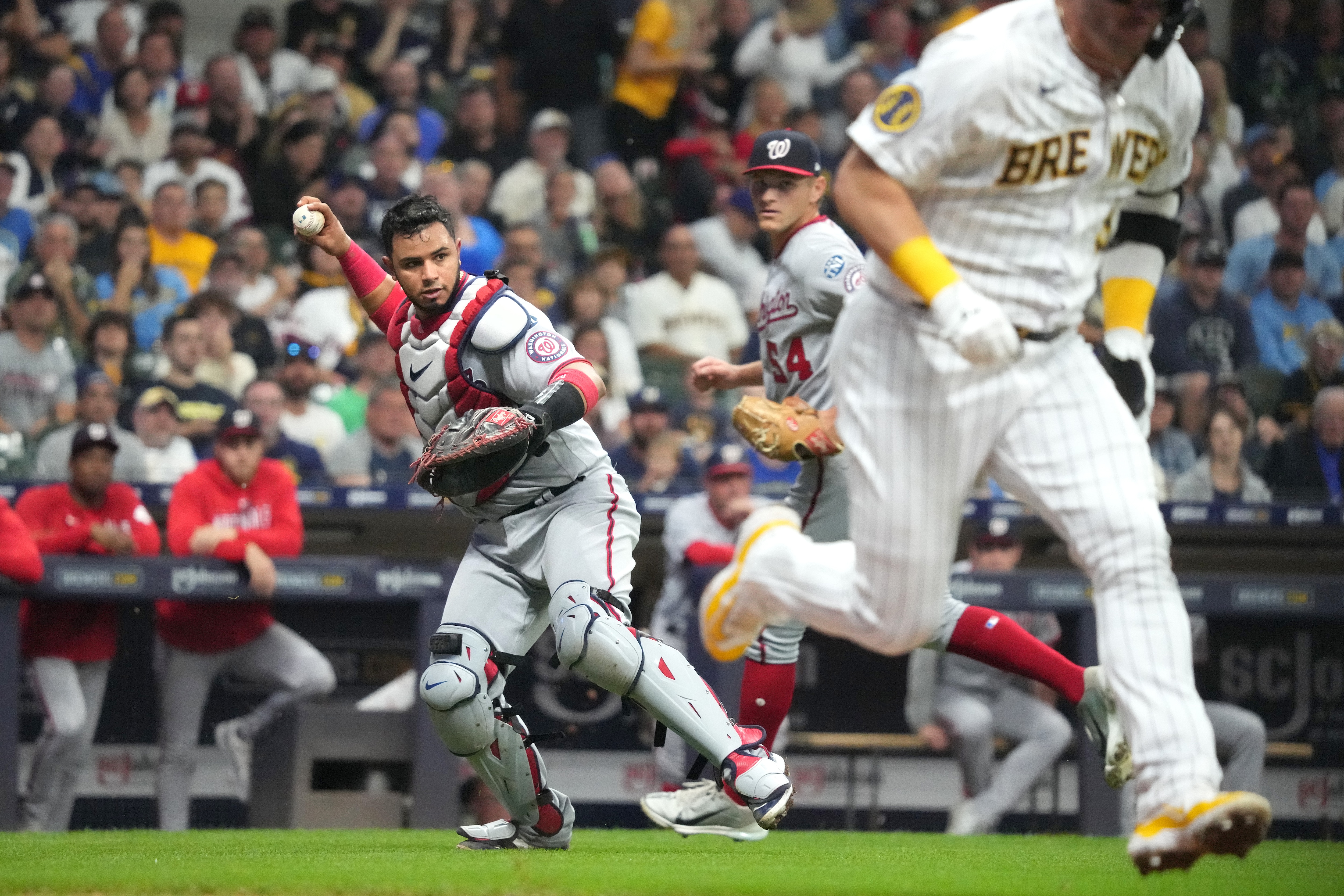 Nationals catcher Keibert Ruiz throws out Josh Donaldson of the Brewers in the third inning.