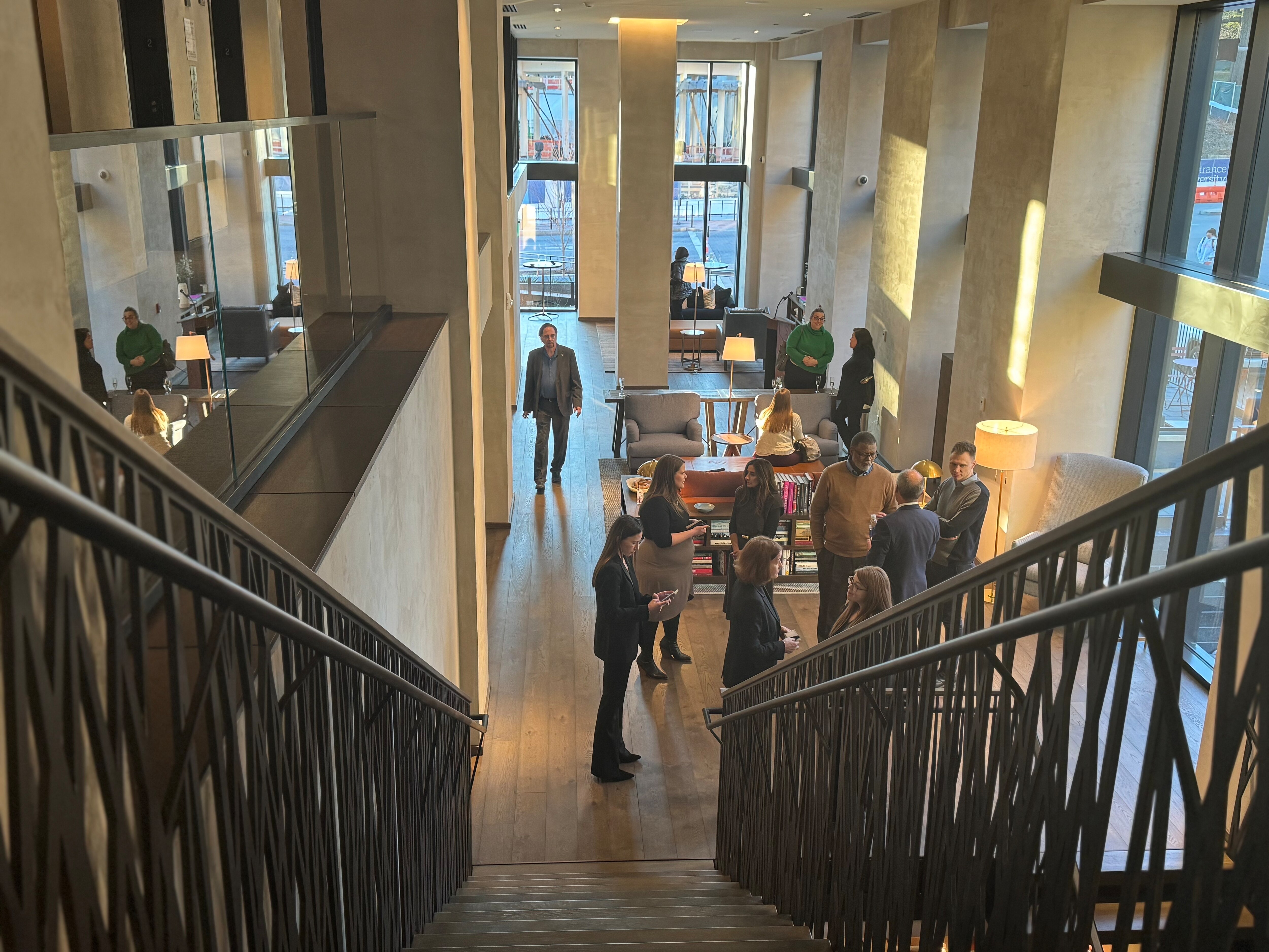 The Study Hotel at Johns Hopkins boasts floor-to-ceiling windows and a long, airy hallway.