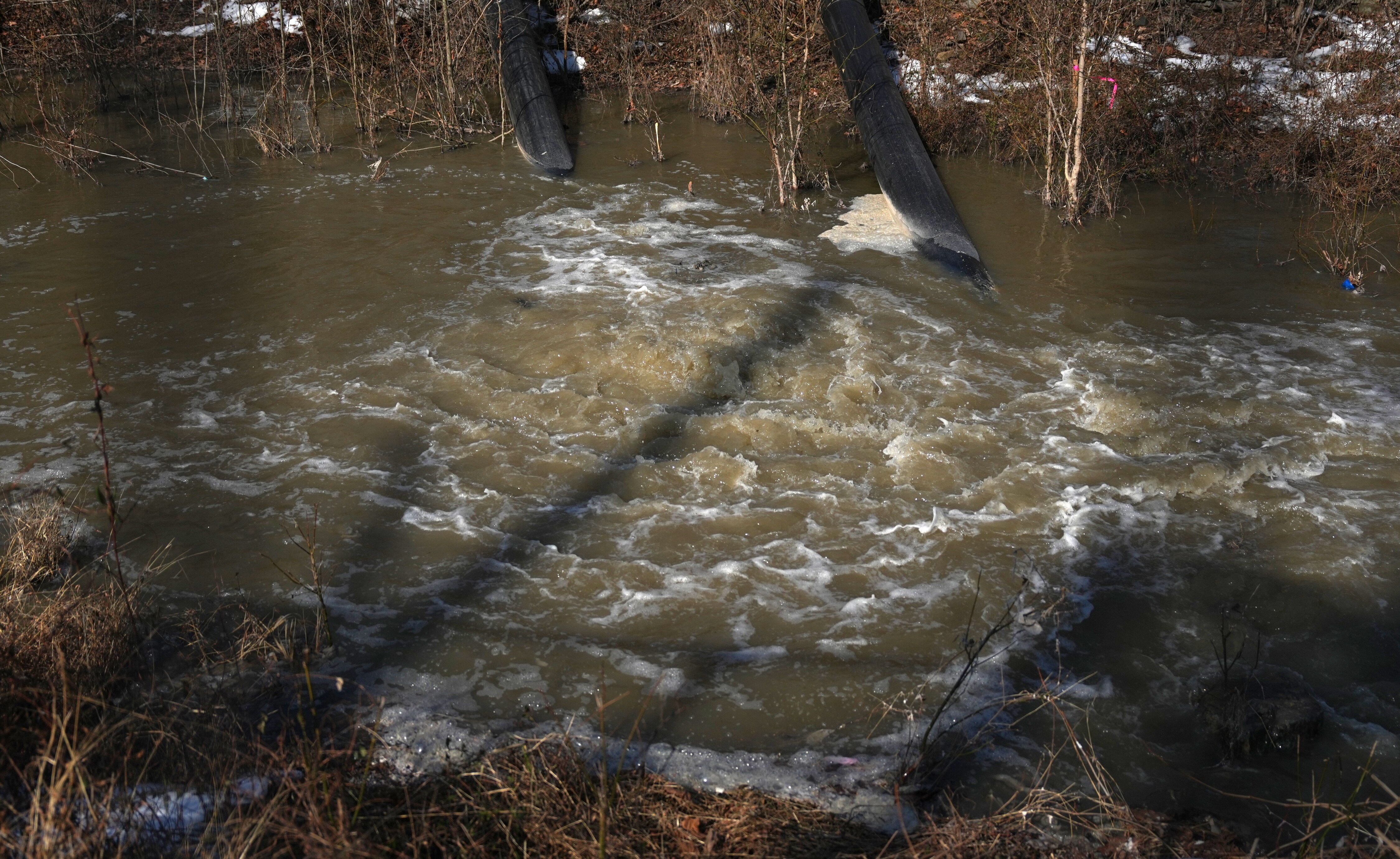 Rerouted sewage flows into the C&O Canal from the collapsed Potomac Interceptor sewer line next to the Clara Barton Parkway in Cabin John, Maryland in February.