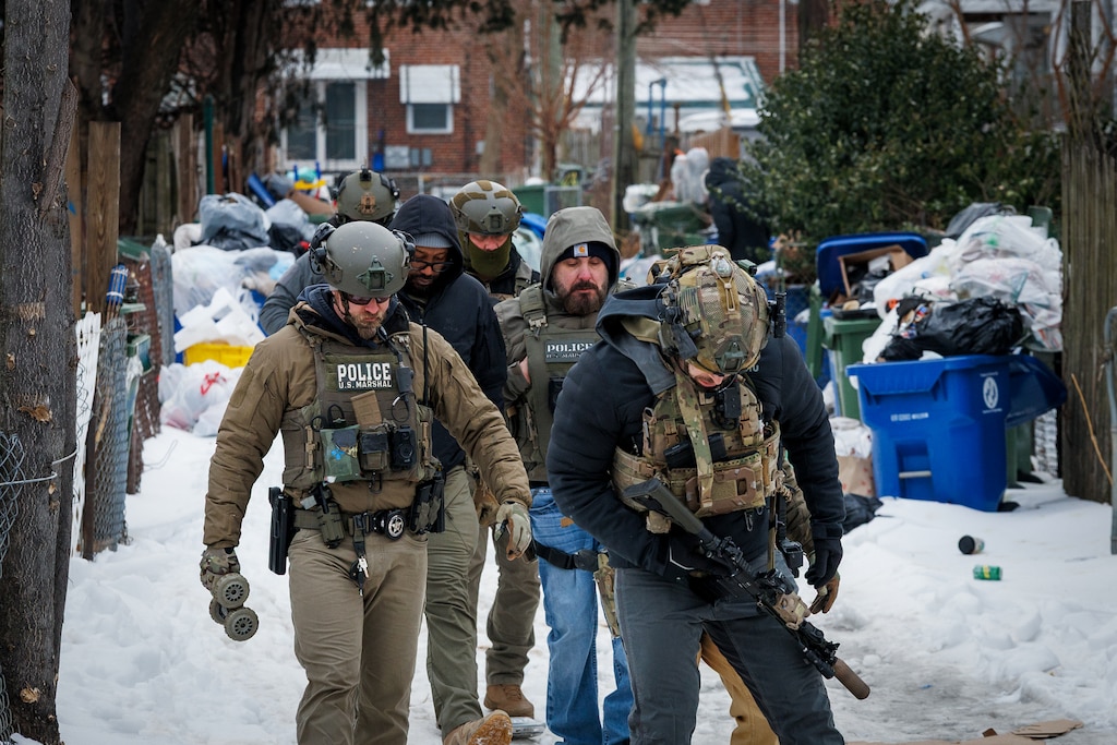 The U.S. Marshals investigate a home on Maude Avenue that agents suspected missing 9-year-old child Tristan King may have been staying.