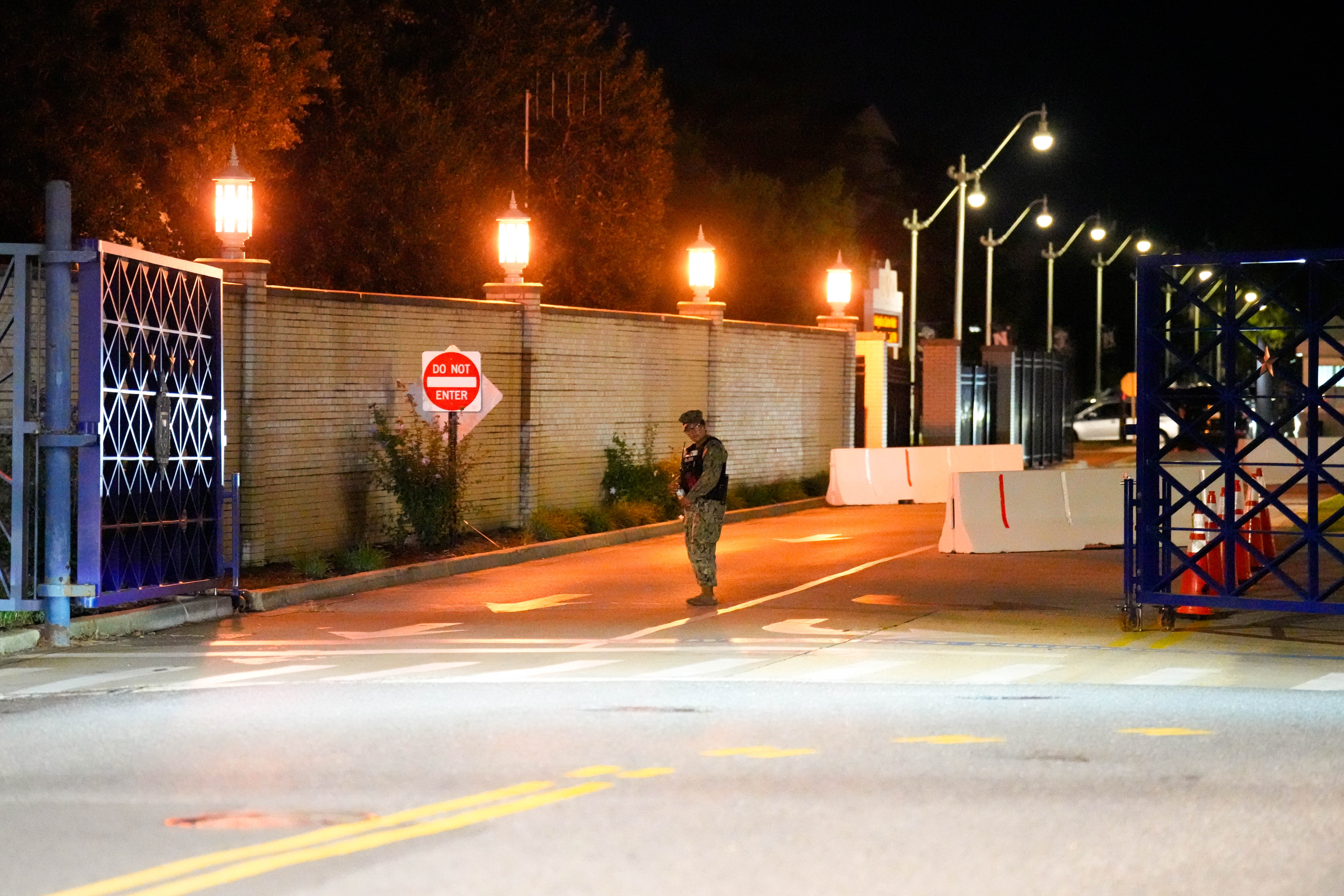 A U.S. Navy Security officer attends Gate 1 at the U.S. Naval Academy in Annapolis on Thursday evening after a lockdown following reports of a shooting on campus.