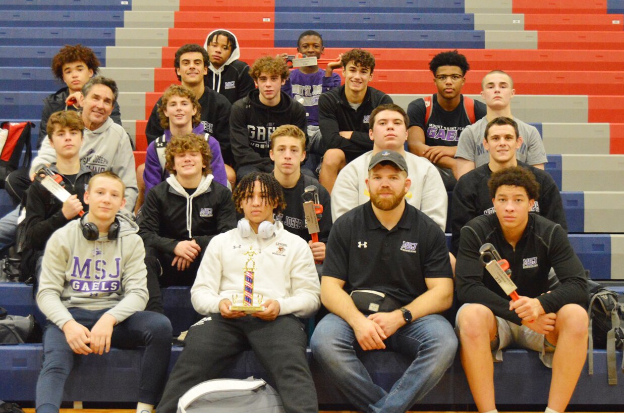 The Mount St. Joseph wrestling team posed for a team photo after their victory in the Elite Opener in West Virginia.