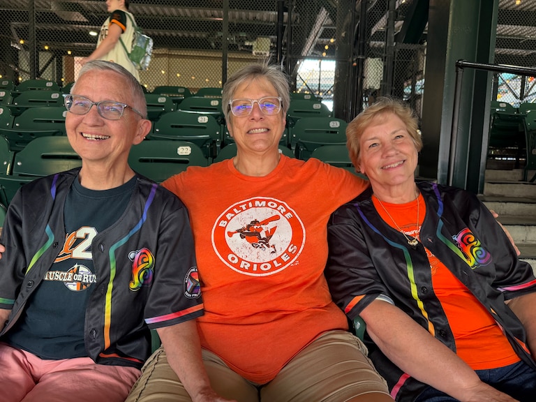 Geri Langan, left, Mary Anne Klim, center, and Michele Krueger came to a game as a part of an OWLS outing and were some of the first people in line to claim their Pride jerseys.