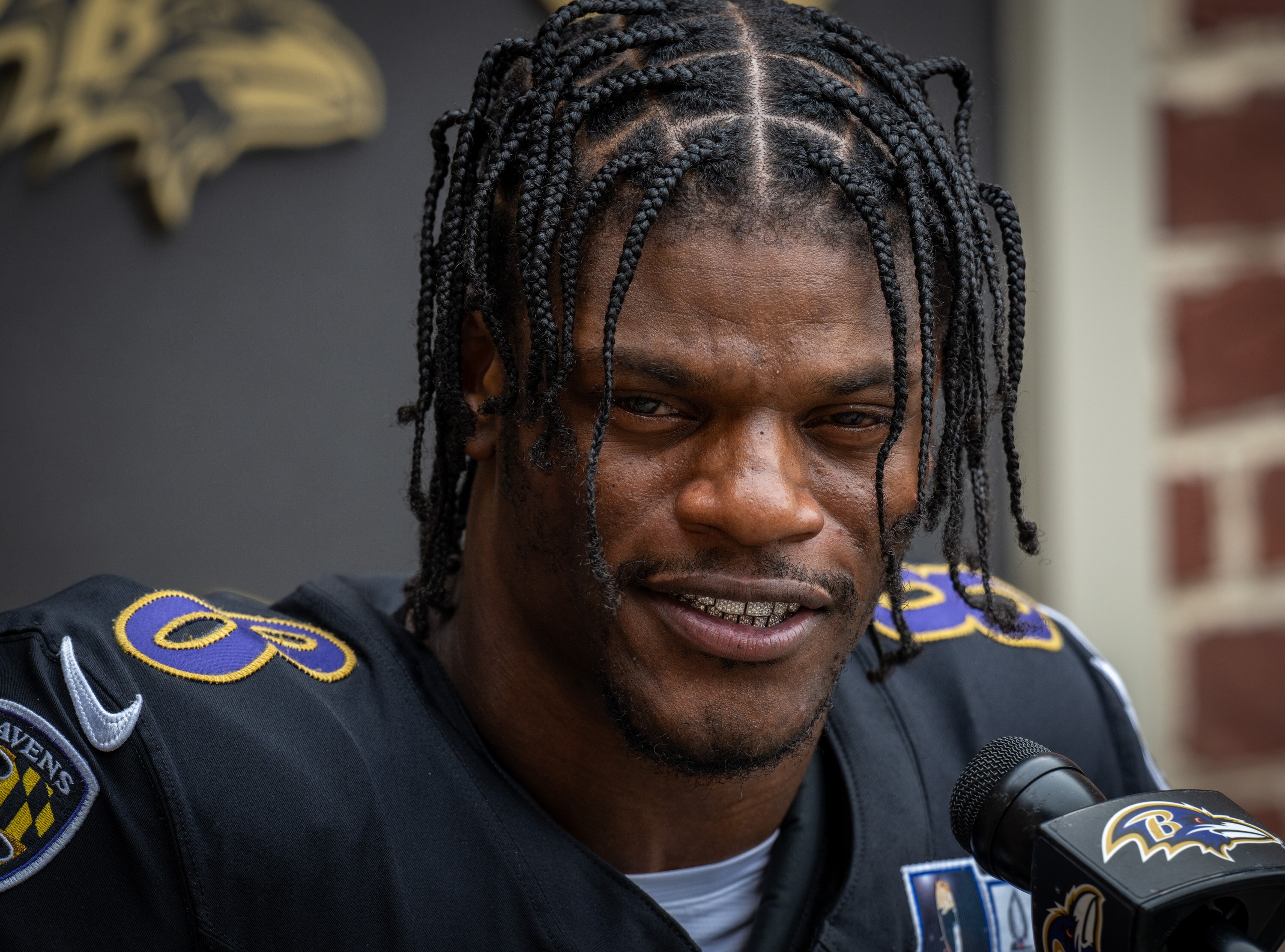 Ravens quarterback Lamar Jackson takes questions from the media following training camp practice last August.