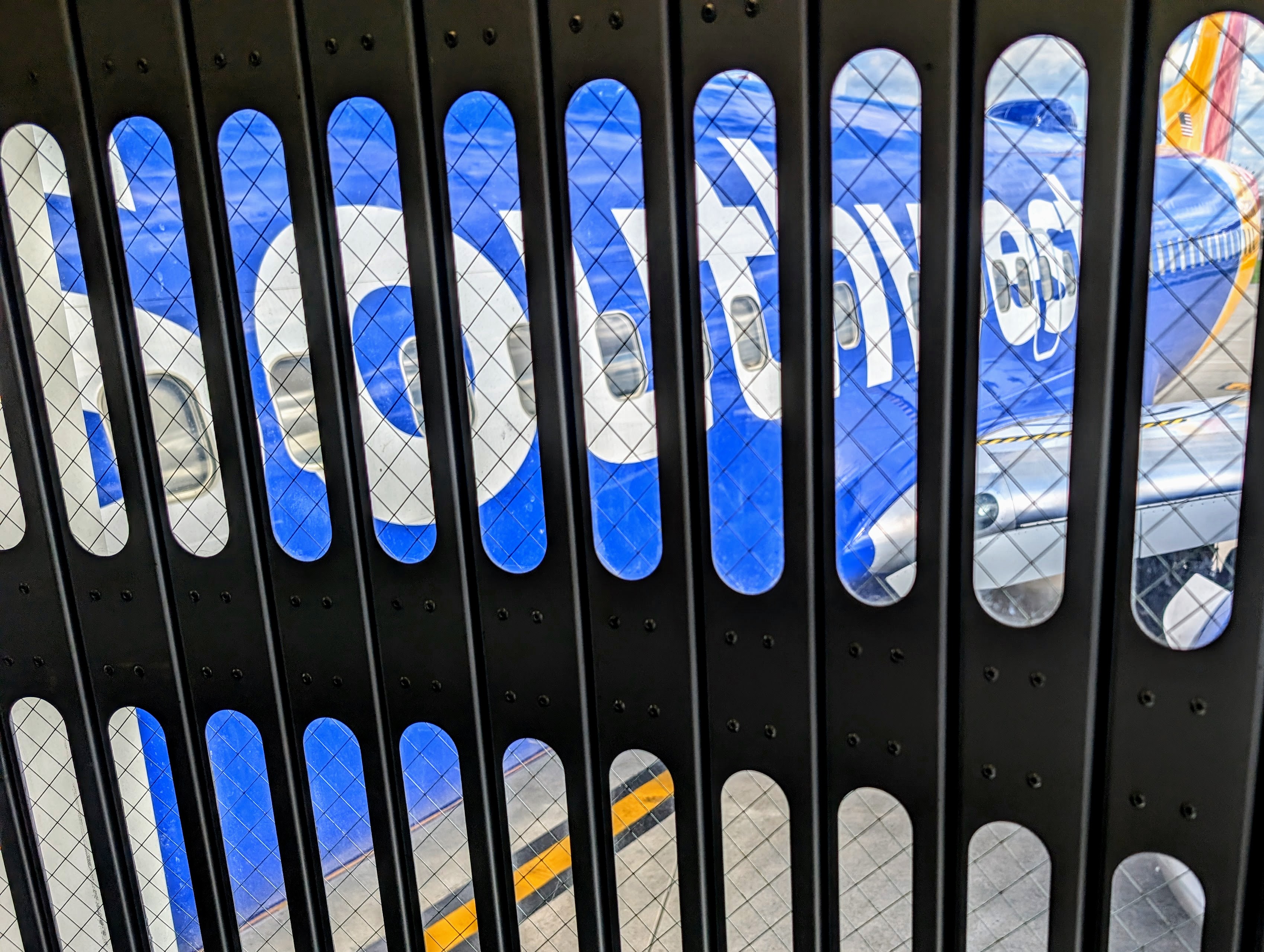 A Southwest Airlines flight sits next to the passenger gate on April 19, 2026 as passengers in Louisville, Kentucky, board for a flight to Baltimore-Washington International Airport.