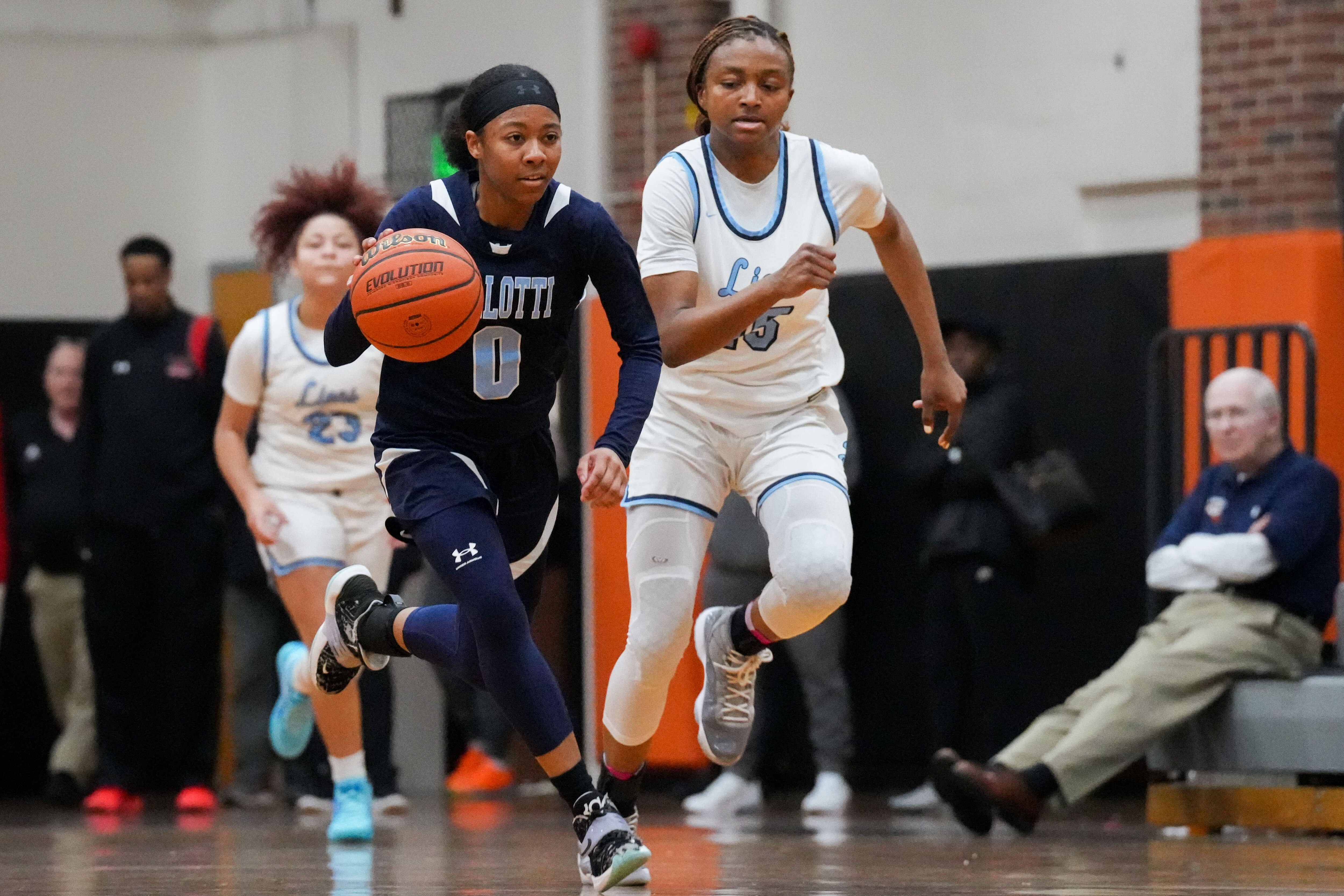 Pallotti’s Sydney Anthony (0) dribbles down the court past Howard defenders. Pallotti’s Howard girls basketball plays St. Vincent Pallotti in the Public vs. Private Challenge held at McDonogh School on 1/21/23.