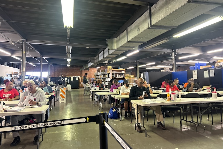 Baltimore City Board of Elections workers open mail-in ballots at the board's West Baltimore warehouse on Thursday, May 16.