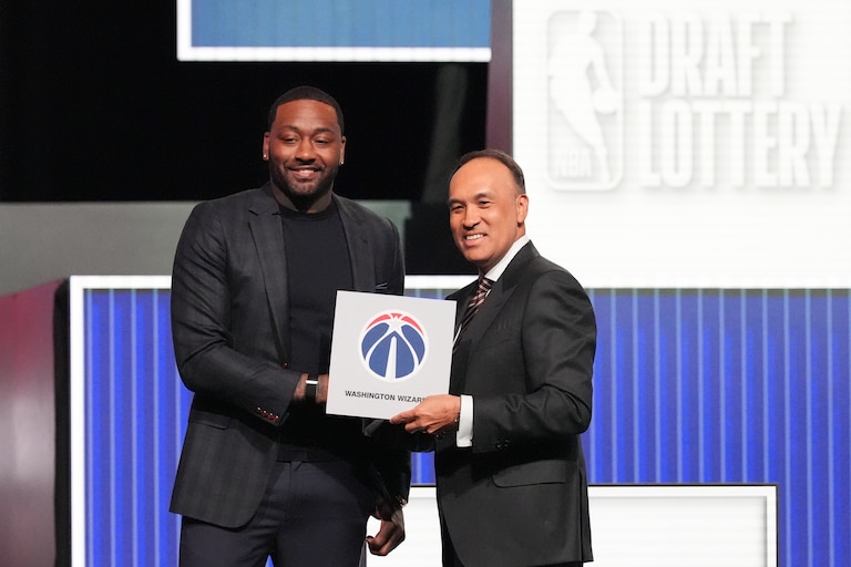 Washington Wizards' John Wall, left, and NBA Deputy Commissioner Mark Tatum, pose for photos after Tatum announced that the Wizards had won the first pick in the draft lottery on May 10.