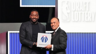 Washington Wizards' John Wall, left, and NBA Deputy Commissioner Mark Tatum, pose for photos after Tatum announced that the Wizards had won the first pick in the draft lottery on May 10.