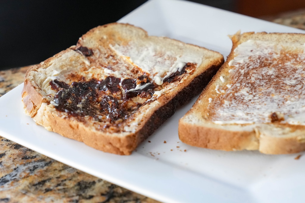 Toast with butter and Marmite sits on the counter of British expat and Catonsville real estate agent Ellie Mcintire in her kitchen on Monday, April 6, 2026.