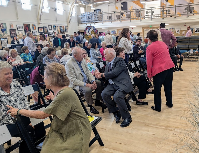 Ben and Myrna Cardin, center, greet some of the 200 people who came to Towson on June 8, 2026 to hear New York Times White House correspondent Erica Green lead a panel discussion on truth and misinformation.