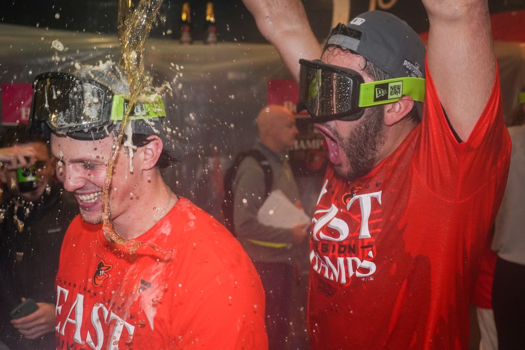 Baltimore Orioles pitcher Grayson Rodriguez douses Adley Rutschman with beer and champagne in the locker room after clinching the AL East division on Thursday, September 28, 2023. The beat the Boston Red Sox, 2-0, to secure control of the division.