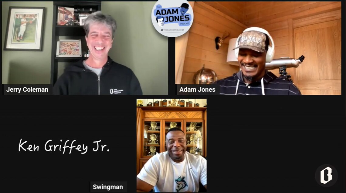 A screenshot of a video shows Jerry Coleman, Adam Jones and Ken Griffey Jr. All three have smiles on their faces.
