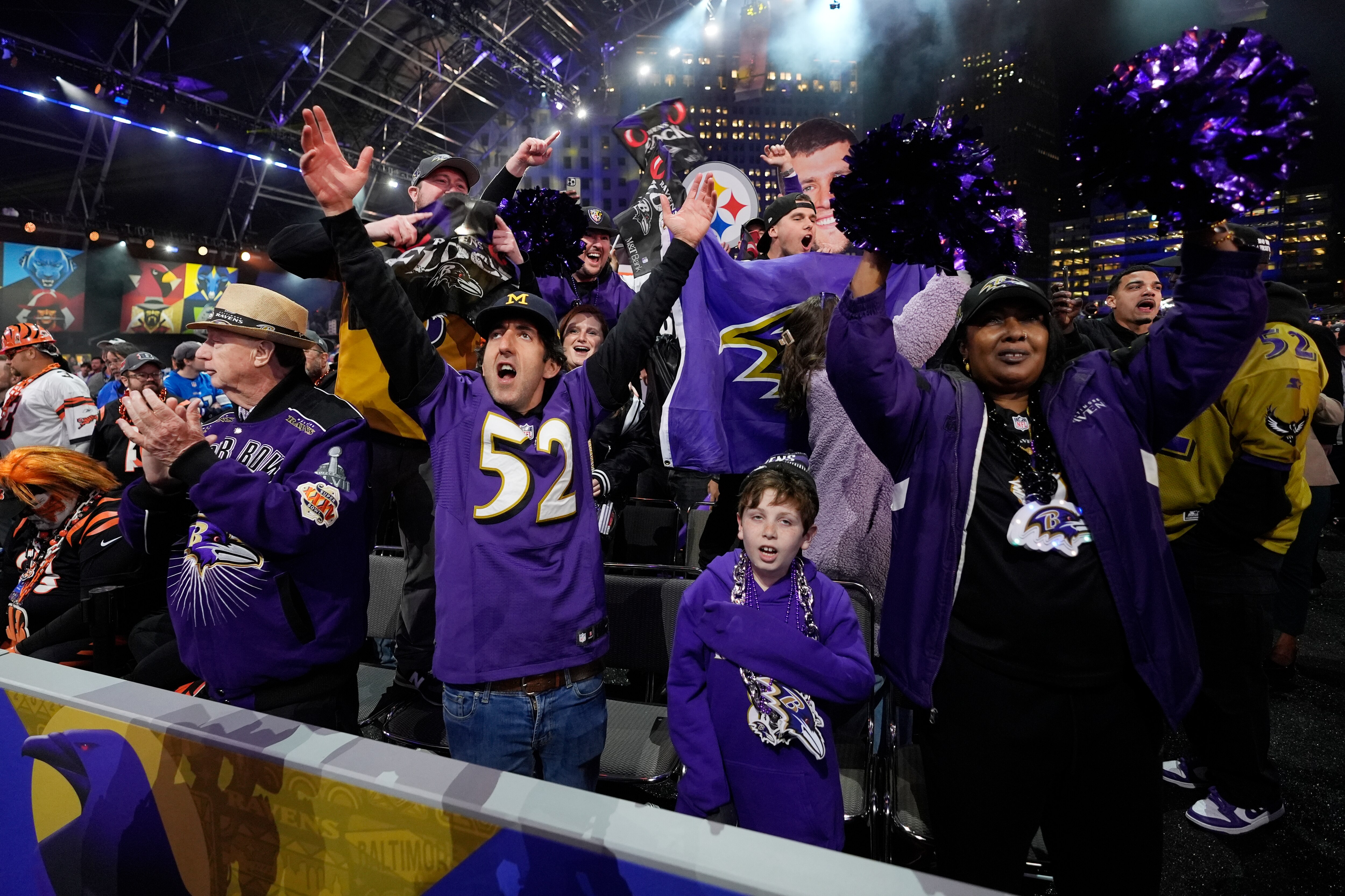Ravens fans celebrate during the first round of the draft Thursday night in Detroit. How long will the party last?