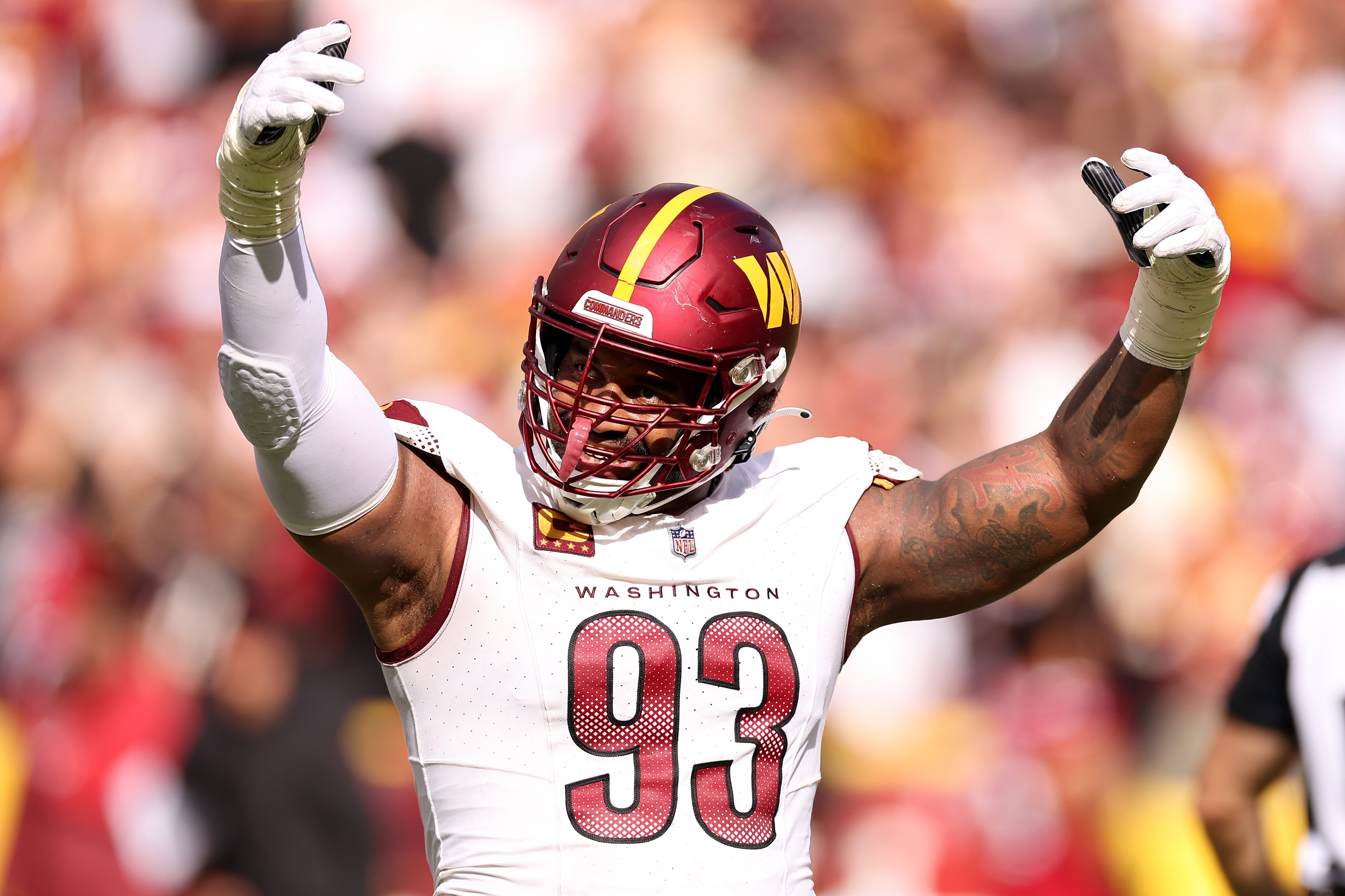 Jonathan Allen of the Commanders celebrates after a play during the first quarter of Washington's 20-16 win over Arizona.