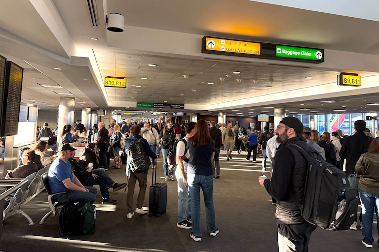 Stranded travelers crowd the Southwest domestic terminal at Baltimore-Washington International Thurgood Marshall Airport on Friday after a ground stop due to a “strong chemical smell” at the region’s air traffic control facility, a Federal Aviation Administration spokesperson said in an email.
