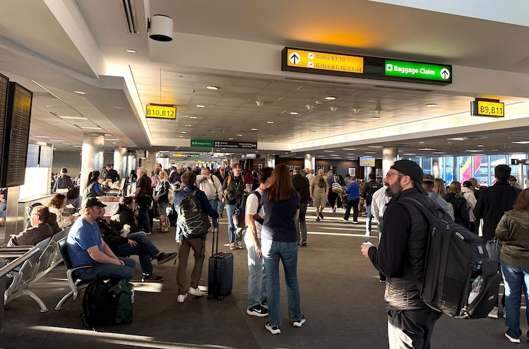 Stranded travelers crowd the Southwest domestic terminal at Baltimore-Washington International Thurgood Marshall Airport on Friday after a ground stop due to a “strong chemical smell” at the region’s air traffic control facility, a Federal Aviation Administration spokesperson said in an email.