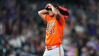 Orioles relief pitcher Luis De León reacts after giving up a two-run home run to Colorado Rockies first baseman TJ Rumfield in the seventh inning.