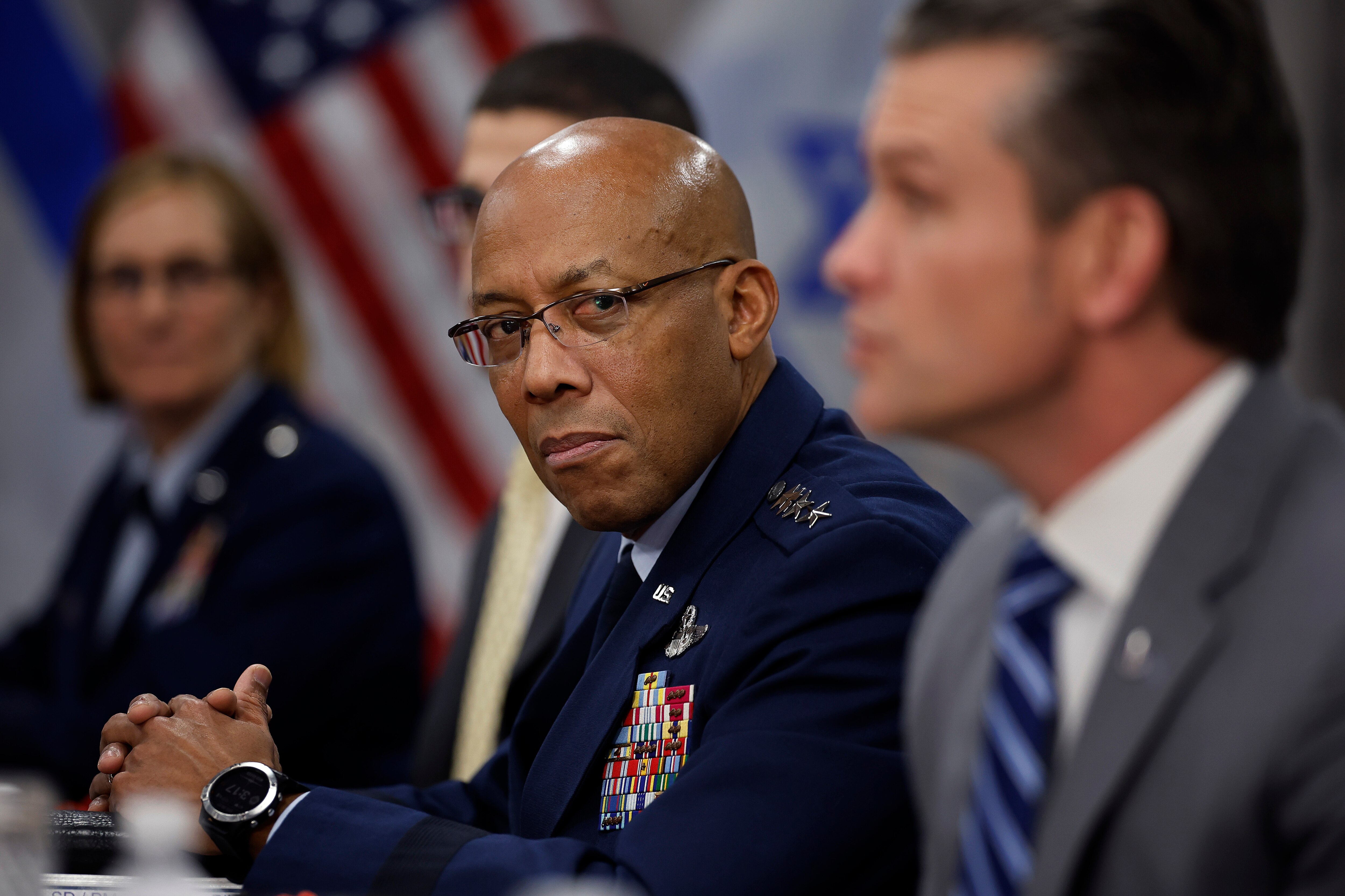 ARLINGTON, VA - FEBRUARY 05: Chairman of the Joint Chiefs of Staff General Charles Brown Jr. listens to U.S. Secretary of Defense Pete Hegseth answer reporters' questions before a meeting with Israeli Prime Minister Benjamin Netanyahu to the Pentagon during an honor cordon on February 5, 2025 in Arlington, Virginia. Secretary Hegseth's meeting with Netanyahu comes a day after President Trump proposed the idea that the U.S. would take an ownership position of Gaza and relocate its people while it is being rebuilt. (Photo by Chip Somodevilla/Getty Images)
