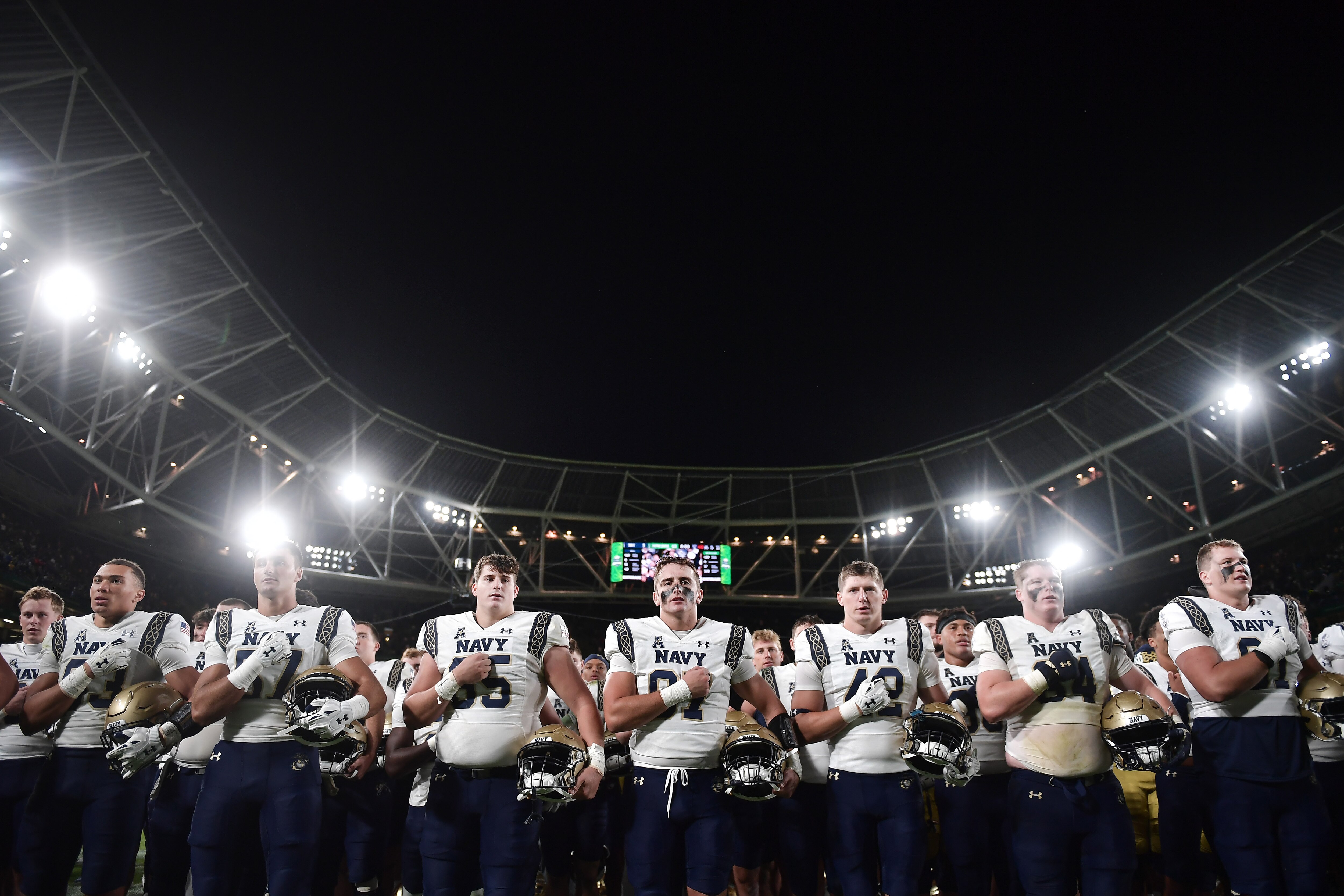 Navy players salute their supporters following the Aer Lingus College Football Classic game between Notre Dame and Navy at Aviva Stadium on Aug. 26, 2023 in Dublin, Ireland. The Midshipmen face Wagner College in their home opener on Saturday, Sept. 9, 2023.