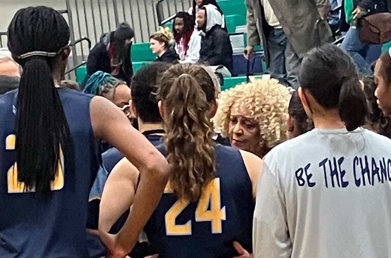 River Hill coach Teresa Waters (center) talks to her team during a timeout in Friday's Class 3A state quarterfinal against St. Charles. Down 15 points in the second half, the Hawks rallied to take the lead late in regulation, but host St. Charles scored the final four points to take a 51-48 victory to advance to the state semifinals.