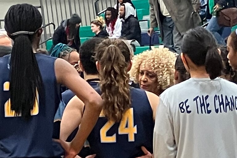 River Hill coach Teresa Waters (center) talks to her team during a timeout in Friday's Class 3A state quarterfinal against St. Charles. Down 15 points in the second half, the Hawks rallied to take the lead late in regulation, but host St. Charles scored the final four points to take a 51-48 victory to advance to the state semifinals.