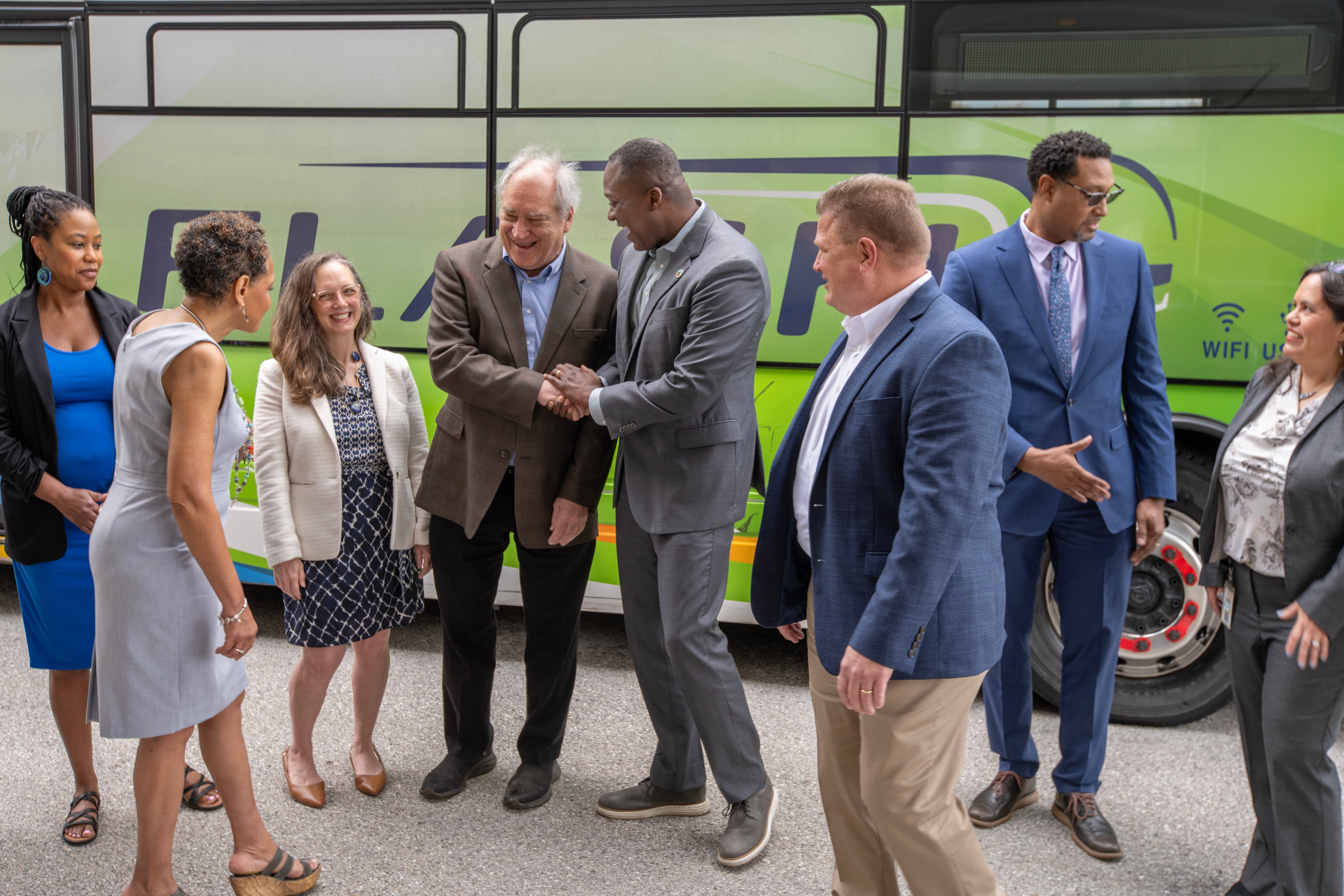 Montgomery County Executive Marc Elrich, center left, and Howard County Executive Calvin Ball, center right, announced a partnership to expand Montgomery‘s Flash bus rapid transit service along Route 29 in mid-2026.