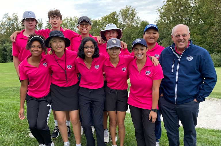 Marriotts Ridge golf coach Mark Dubbs poses with his boys and girls Howard County championship teams. The Mustang girls completed their third straight undefeated season, while the boys extended their win streak, which began in 2013, to 89 consecutive matches.