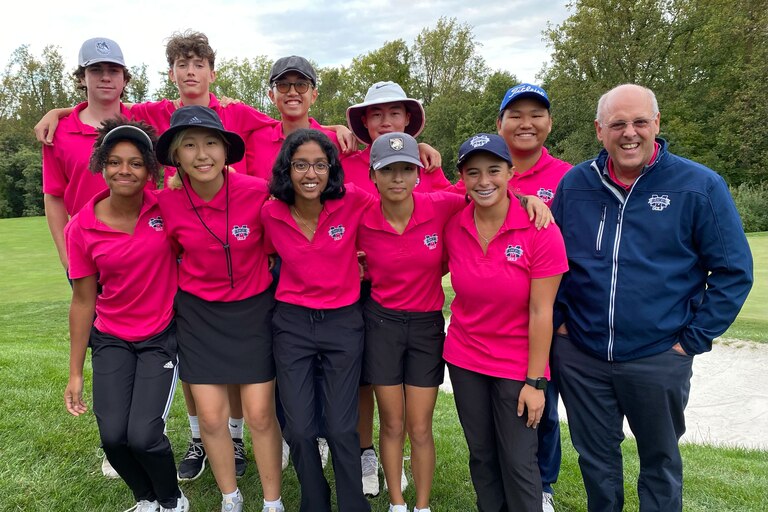 Marriotts Ridge golf coach Mark Dubbs poses with his boys and girls Howard County championship teams. The Mustang girls completed their third straight undefeated season, while the boys extended their win streak, which began in 2013, to 89 consecutive matches.