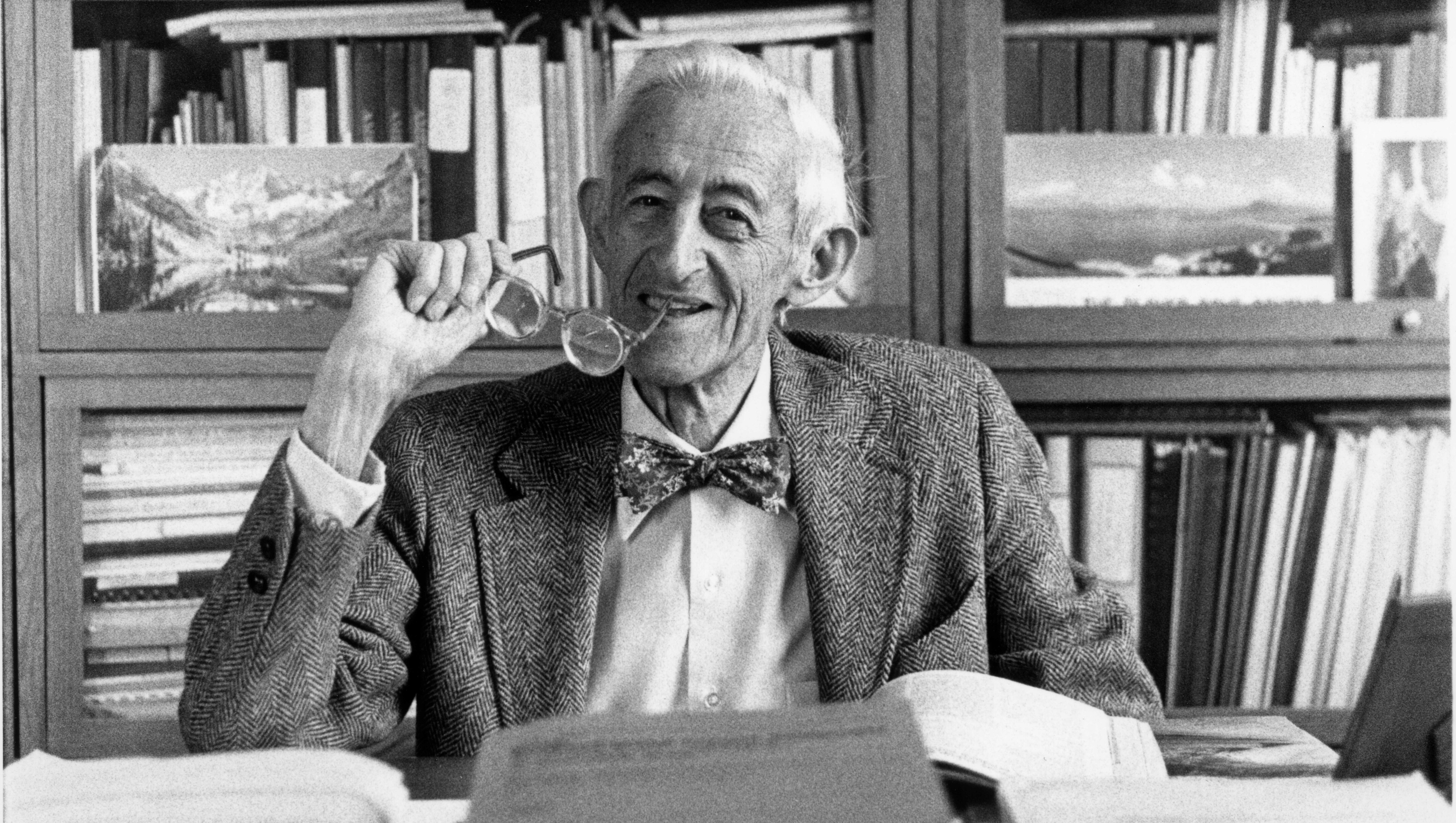 Portrait of Abel Wolman at approximately 90 years old in his office with his glasses in hand.