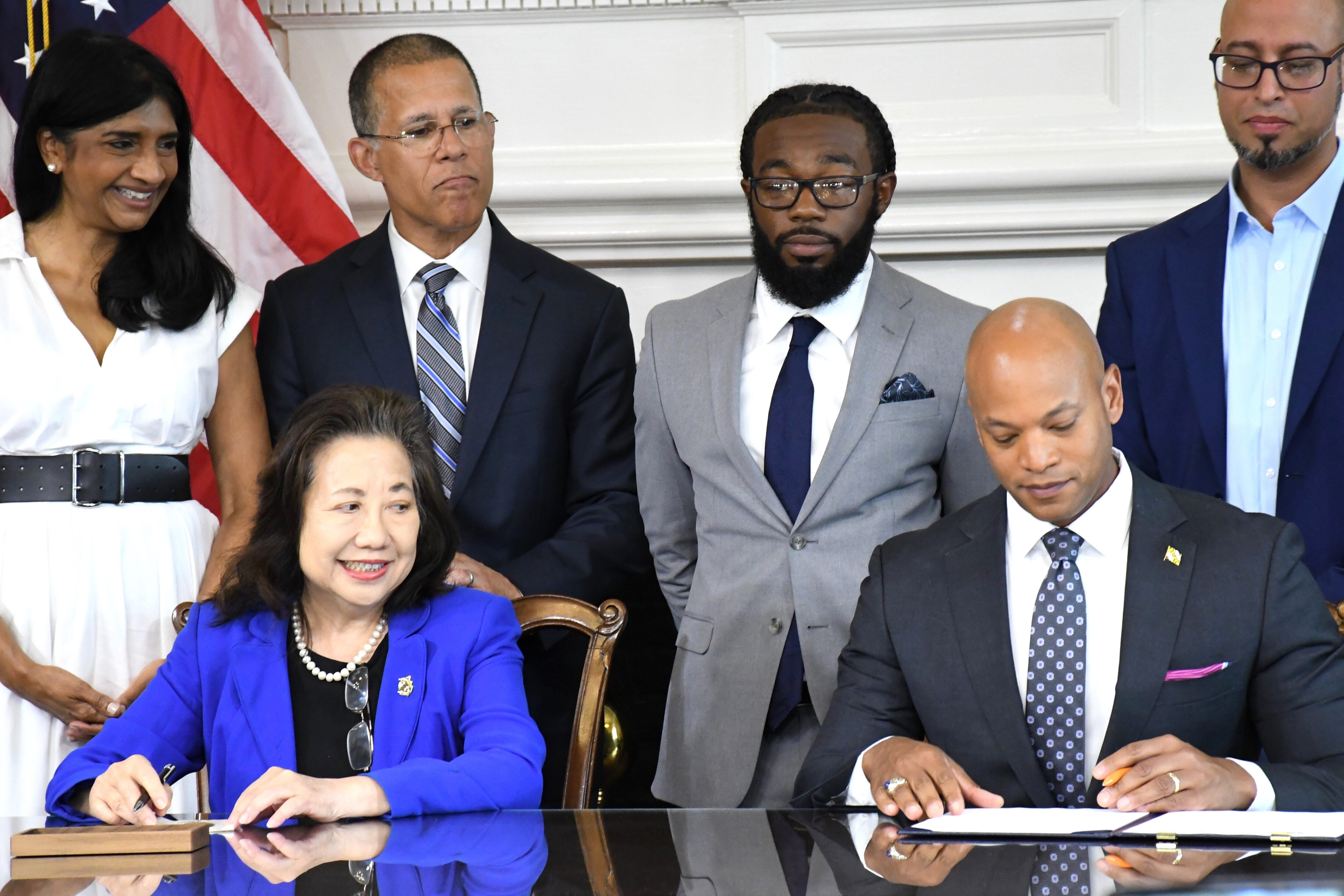 Maryland Gov. Wes Moore signs paperwork pardoning more than 175,000 cannabis-related convictions during a ceremony at the State House in Annapolis in June.