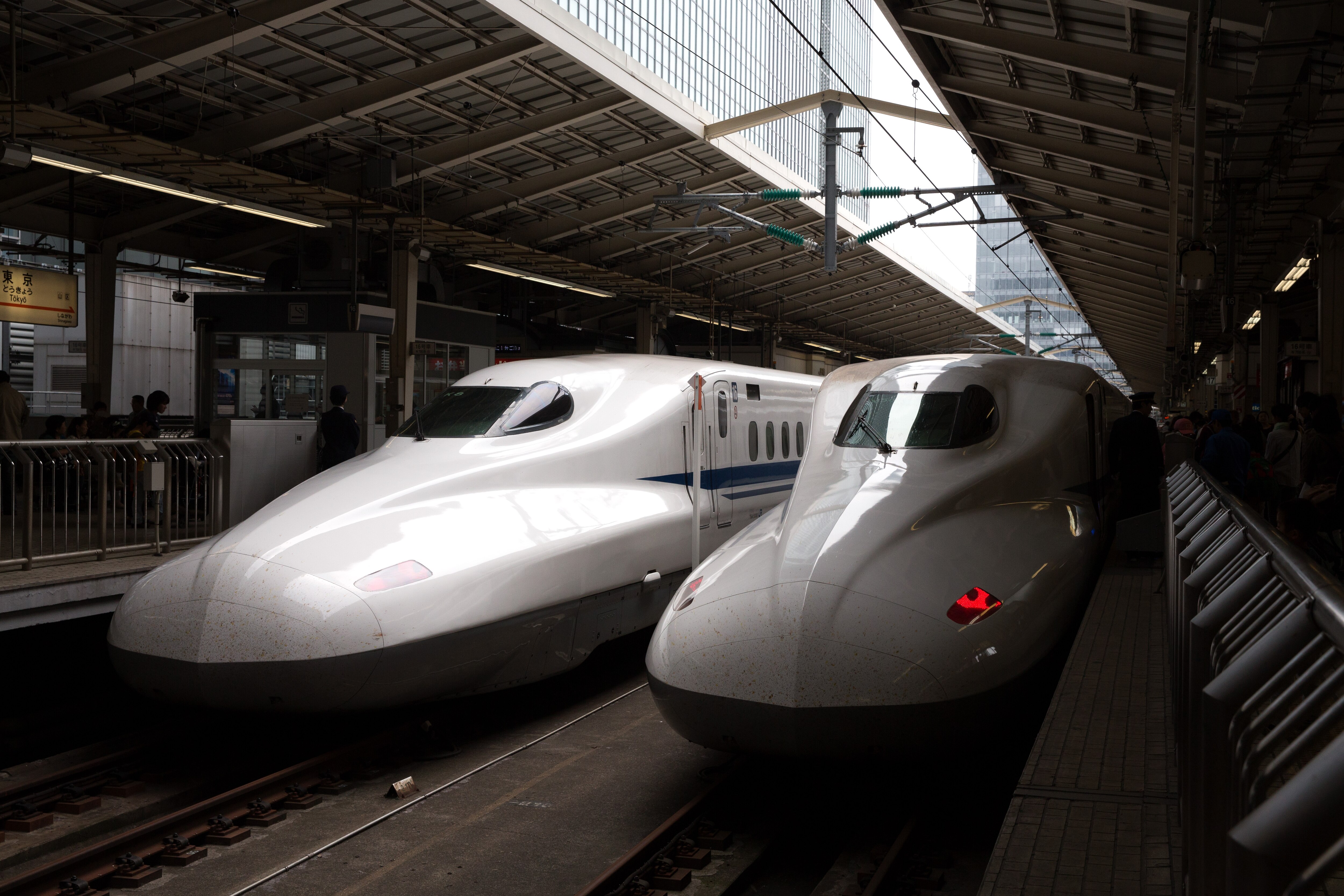 TOKYO, JAPAN - MAY 02:  Shinkansen bullet trains are stopped at Tokyo Train Station on May 02, 2016 in Tokyo, Japan. The Shinkansen is a network of high-speed railway lines in Japan currently consisting of 2,764.6 km (1,717.8 mi) of lines with maximum speeds of 240-320 km/h (150-200 mph). The network presently links most major cities on the islands of Honshu and Kyushu, and Hakodate on northern island of Hokkaido. The maximum operating speed is 320 km/h (200 mph) though test runs have reached up to a world record 603 km/h (375 mph) for maglev trains in April 2015.