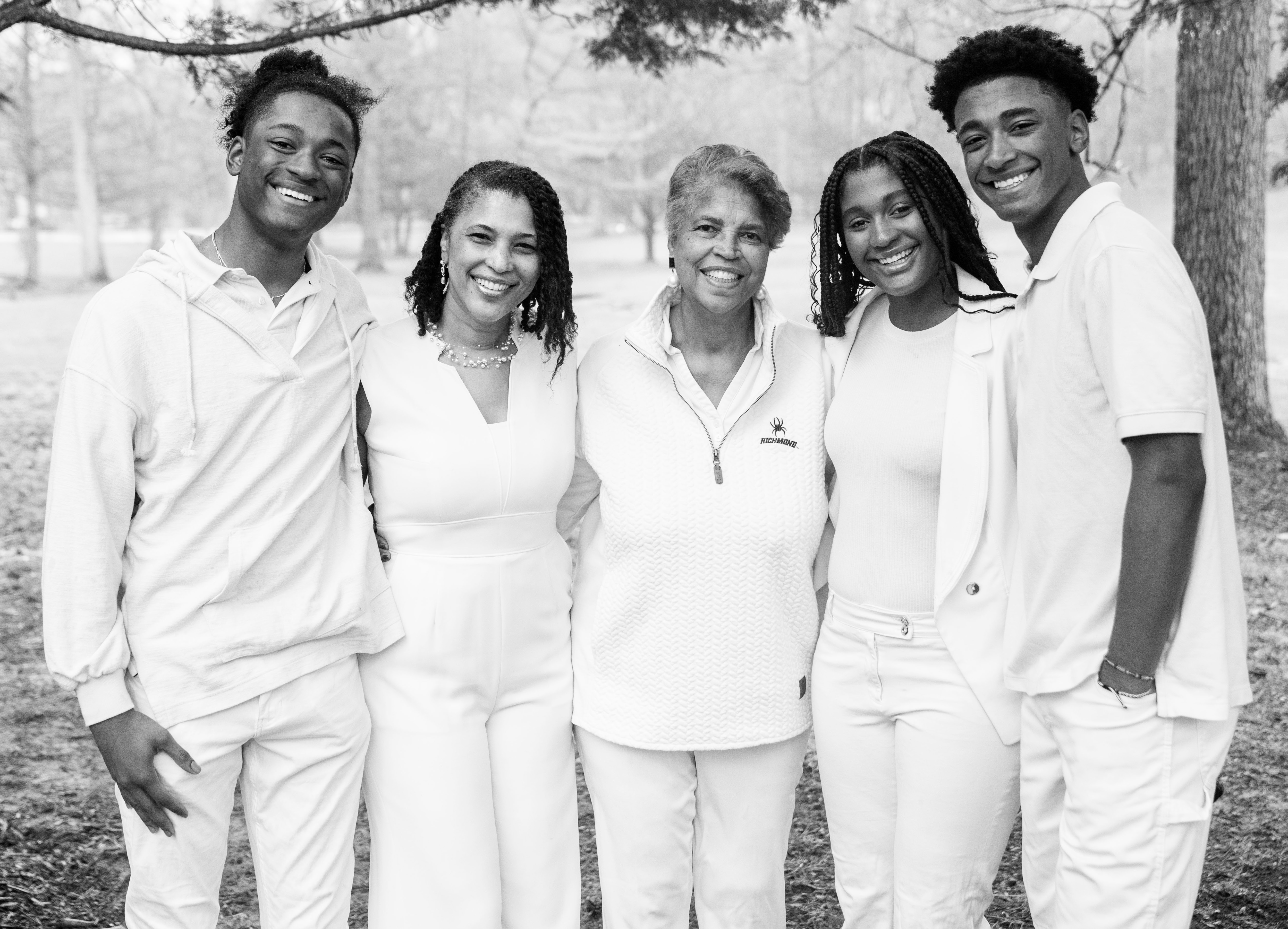 Kai Hammond, Dr. Camille Hammond, Dr. Tinina Cade, Simone Hammond and Aaron Hammond all poses together for a portrait outside their home in Reisterstown, March 25, 2023.