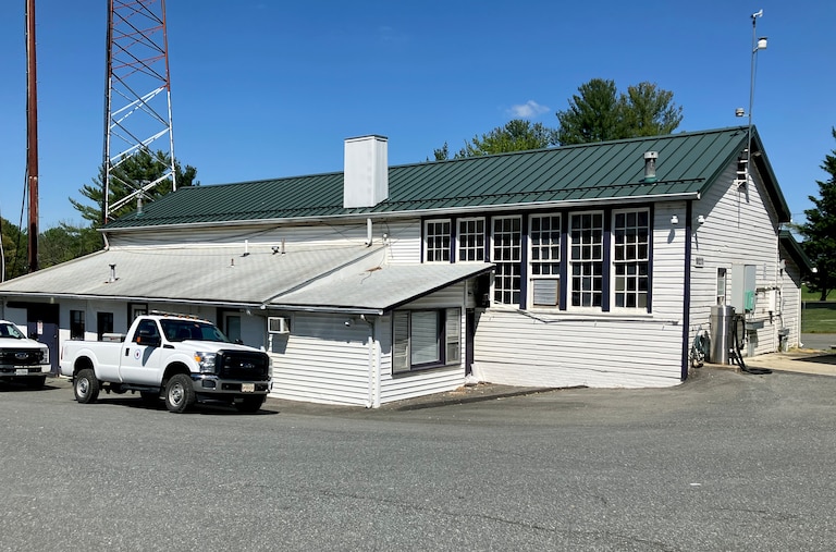 The Rosenwald School in Poolesville has been transformed into an office for the DOT facility. The floors have been removed but the original walls and some of the eight-foot windows remain.
