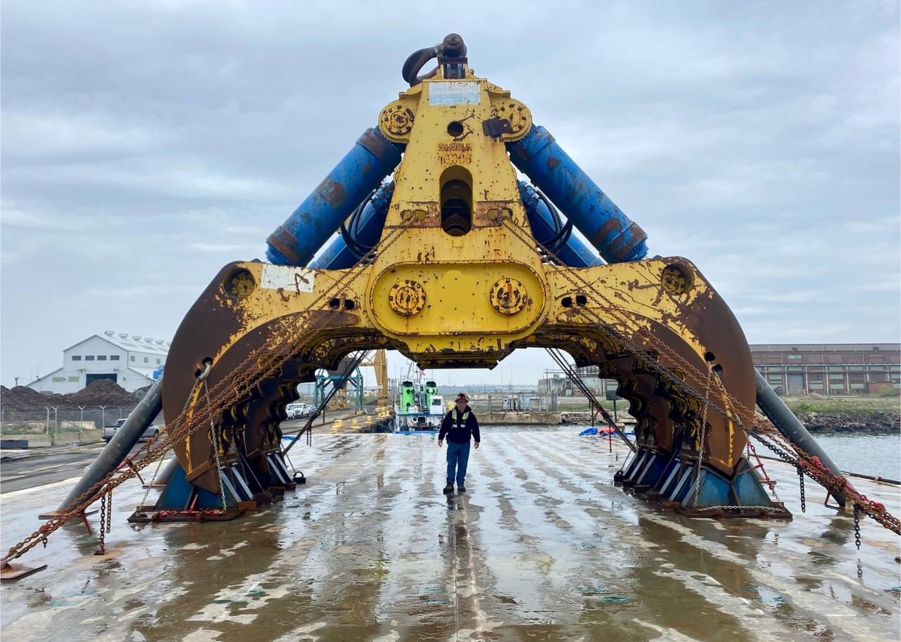 A hydraulic salvage grab that resembles the talons of a giant bird of prey is in the process of being attached to the Chesapeake 1000 crane.
