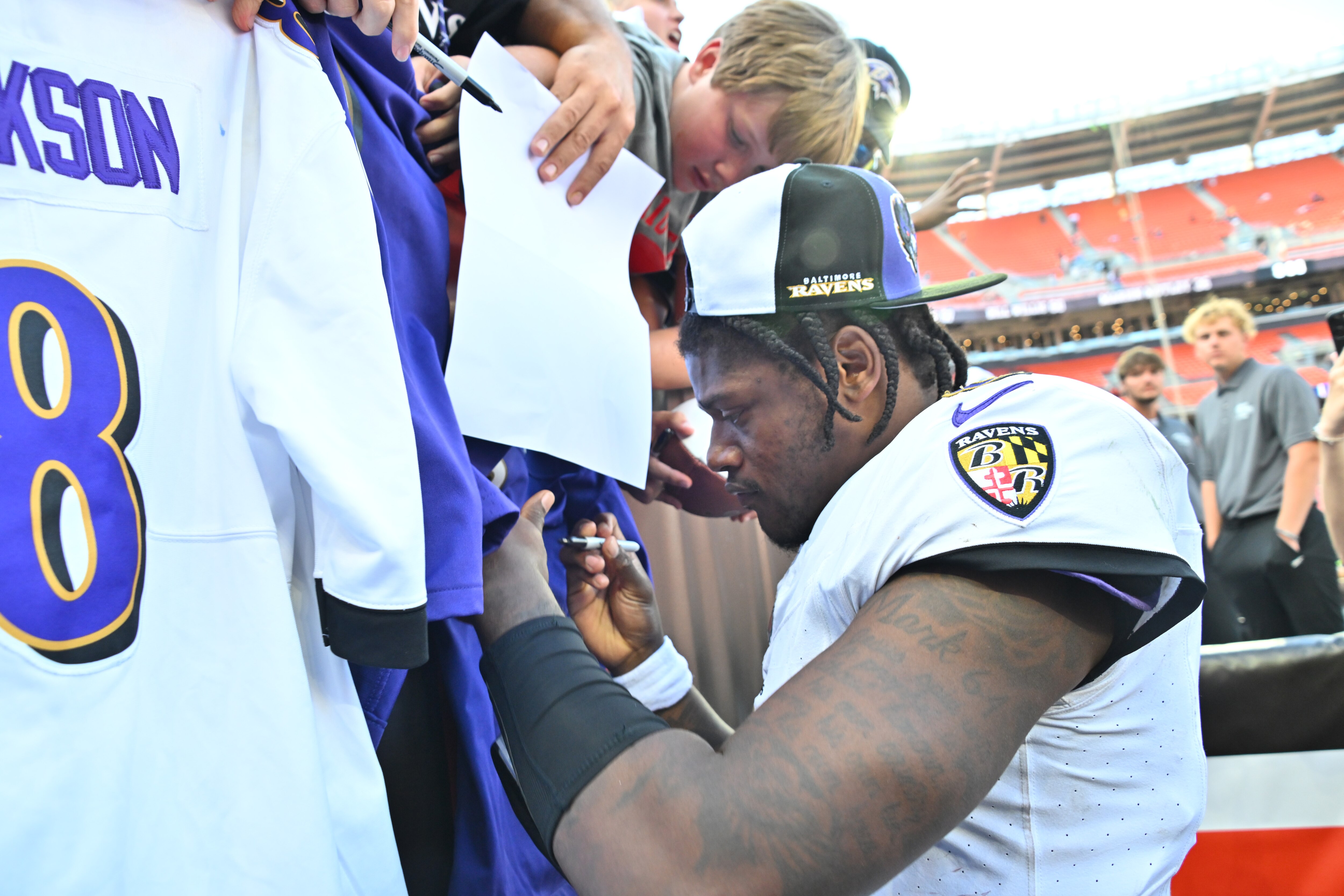 Lamar Jackson #8 of the Baltimore Ravens signs autographs after his team’s 28-3 win against the Cleveland Browns at Cleveland Browns Stadium on Oct. 1, 2023 in Cleveland, Ohio.