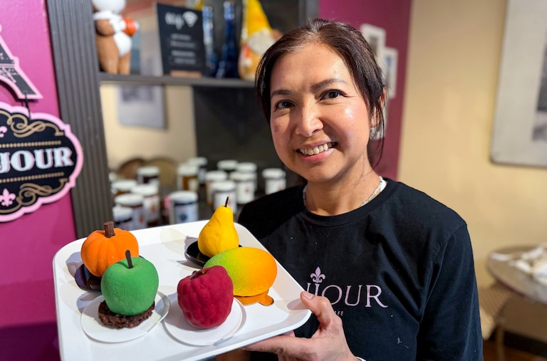 Bonjour owner Nicha McInnes shows off the different varieties of crunchy fruit mousse sold by her shop.