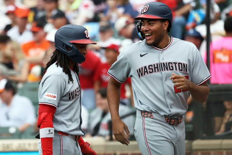 Nationals' James Wood, right, celebrates with teammate CJ Abrams, left, after scoring during the third inning of a game against the Orioles on June 28.