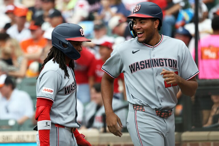 Nationals' James Wood, right, celebrates with teammate CJ Abrams, left, after scoring during the third inning of a game against the Orioles on June 28.