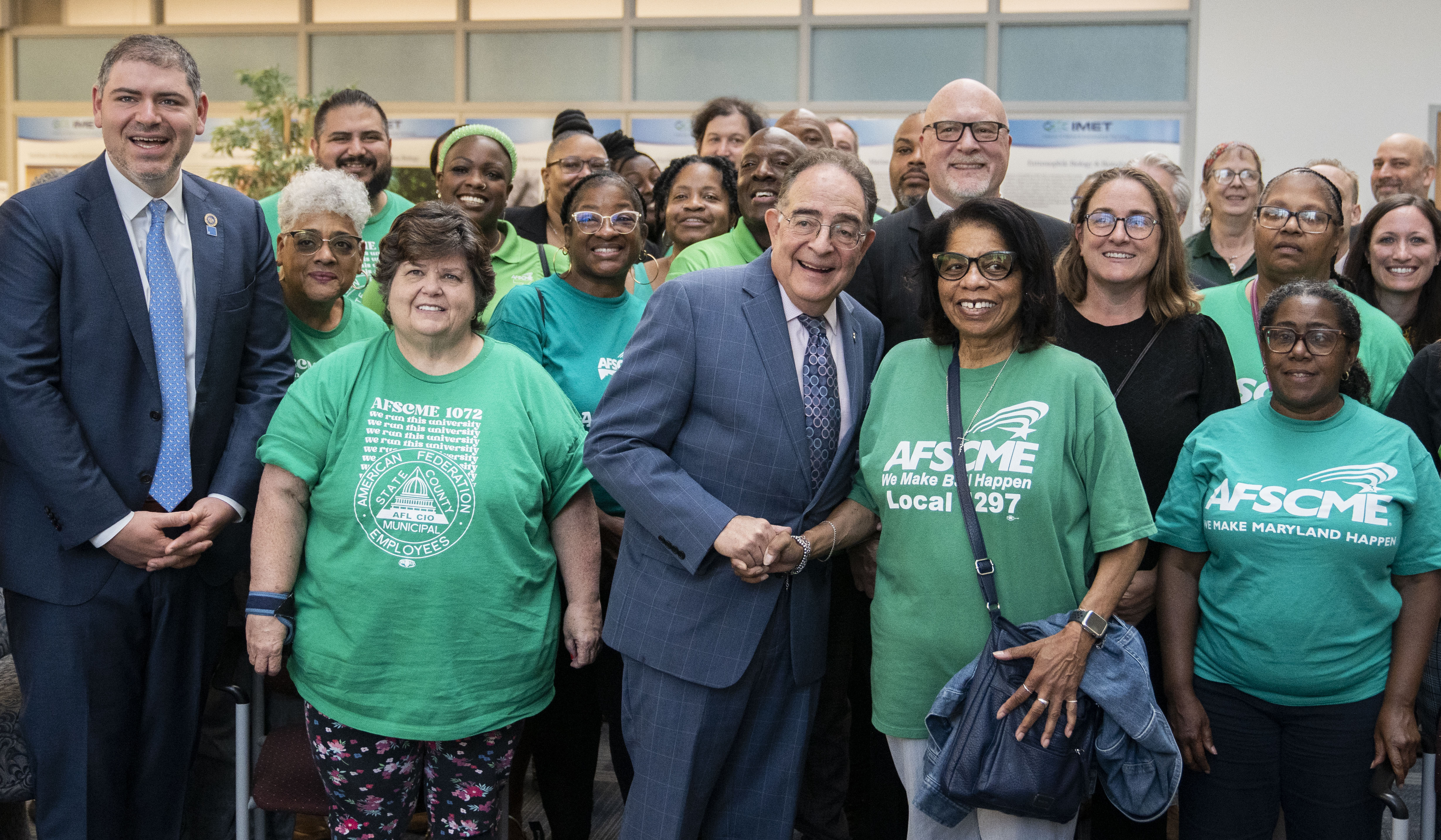 Those attending the signing of the new union labor contract for the University System of Maryland pose for a portrait in Baltimore on Friday.