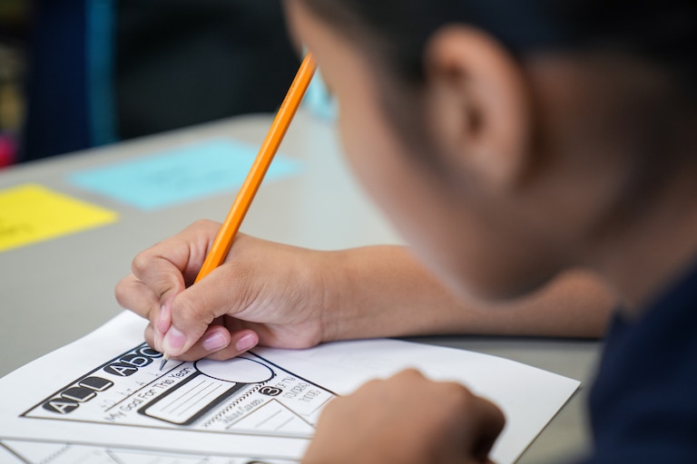 A student fills out an assignment for class inside Hampstead Hill Academy on 8/29/22. Monday was the first day back to school for Baltimore City students.