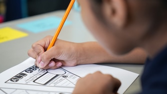 A student fills out an assignment for class inside Hampstead Hill Academy on 8/29/22. Monday was the first day back to school for Baltimore City students.