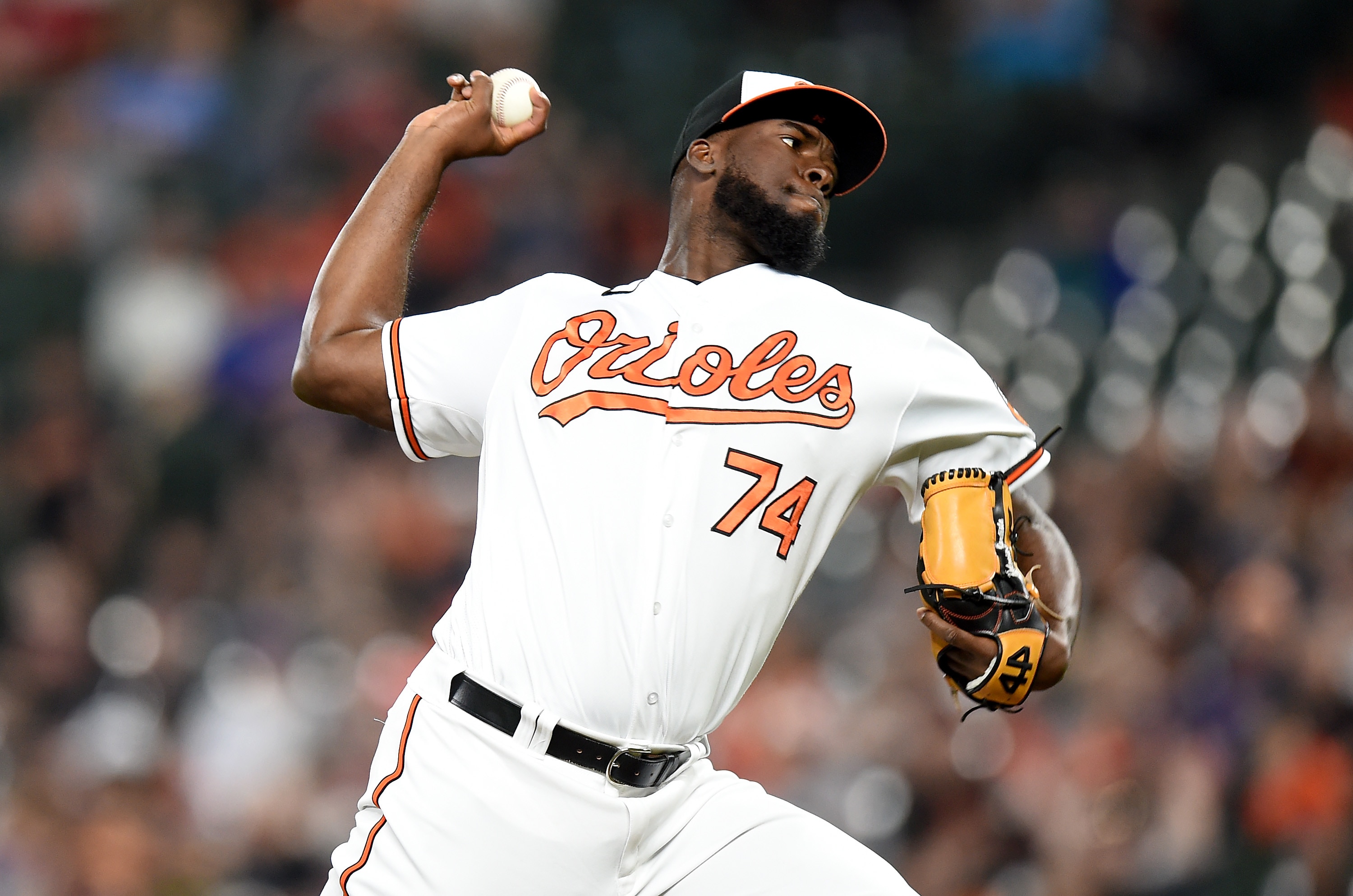 Felix Bautista #74 of the Baltimore Orioles pitches in the eighth inning against the Milwaukee Brewers at Oriole Park.