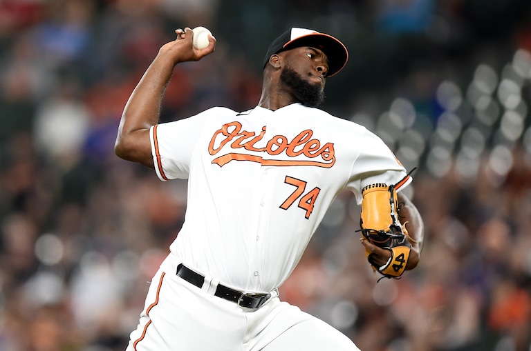 Felix Bautista #74 of the Baltimore Orioles pitches in the eighth inning against the Milwaukee Brewers at Oriole Park.