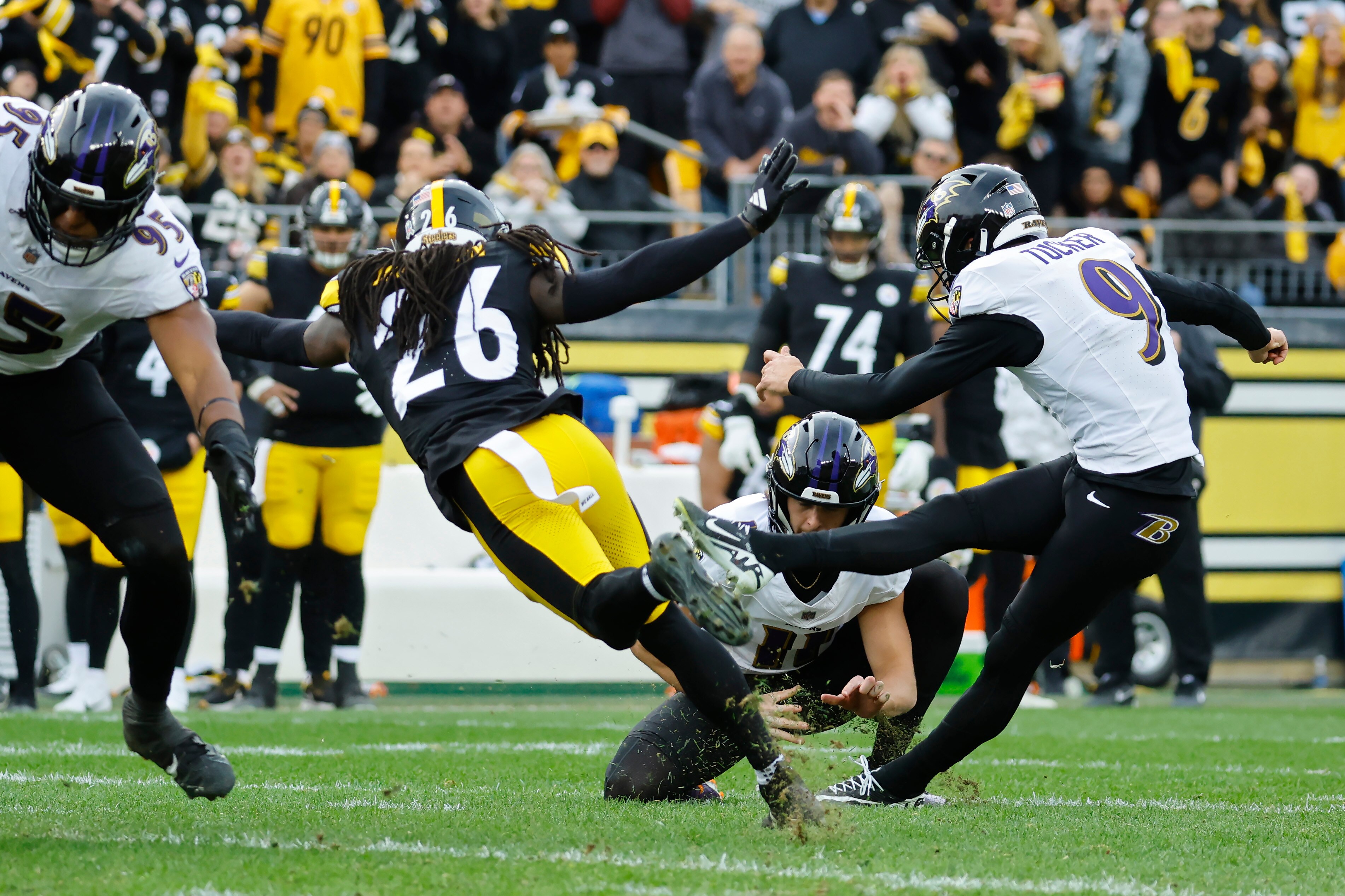 Justin Tucker kicks a field goal in the third quarter against the Pittsburgh Steelers.