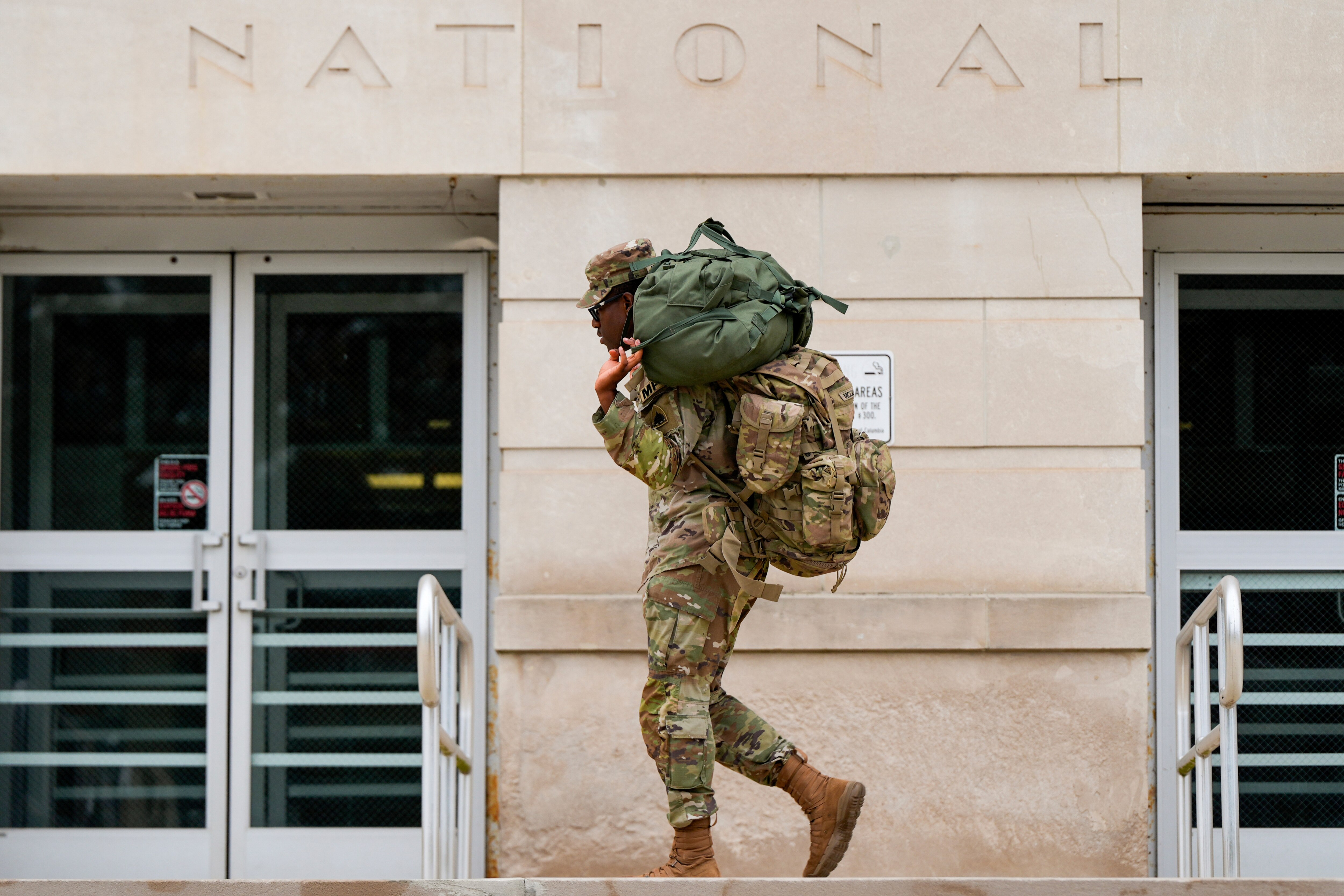 A member of the District of Columbia National Guard arrives at the District of Columbia National Guard Headquarters, Tuesday, Aug. 12, 2025, in Washington.