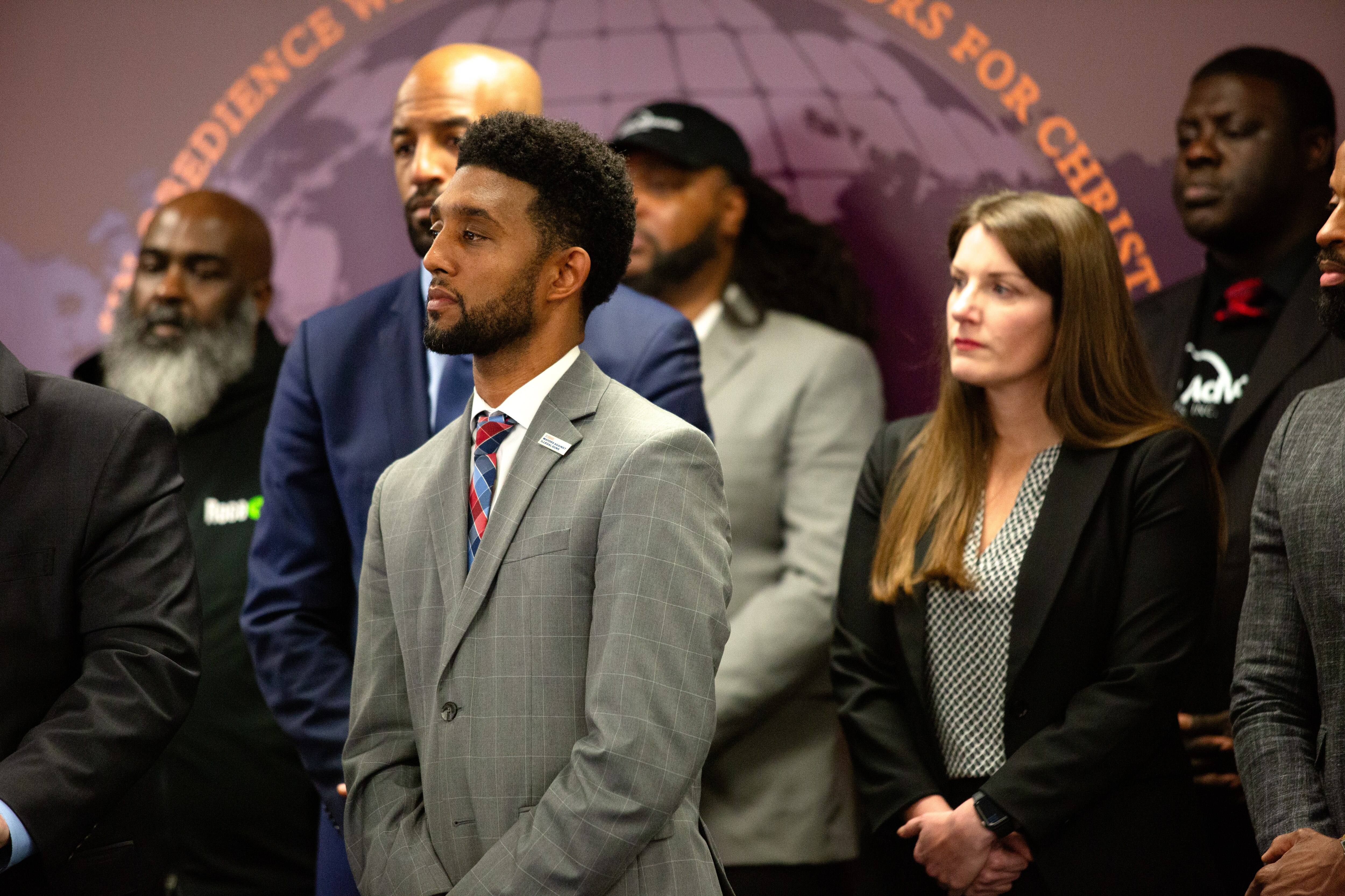 Baltimore Mayor Brandon Scott listens as a team of crime analysts from the University of Pennsylvania presents findings from a new anti-violence report at a press conference on Thursday, Feb. 8, 2024. The report assessed early impacts of the city's group violence reduction strategy in the historically violent Western District.