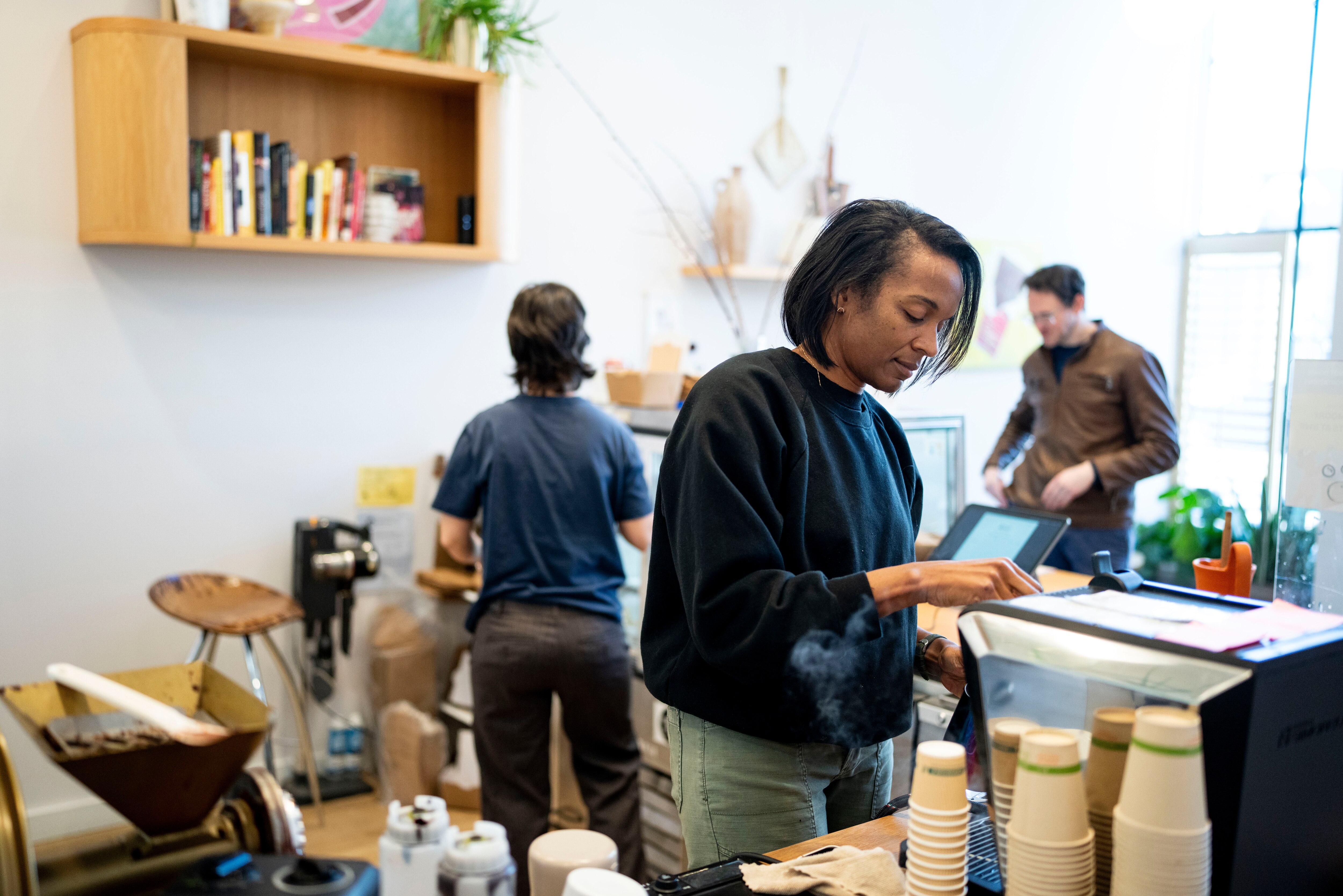 Jinji Fraser owner of Jinji Chocolate works on an order inside of the shop in Baltimore, Saturday November 29, 2025.