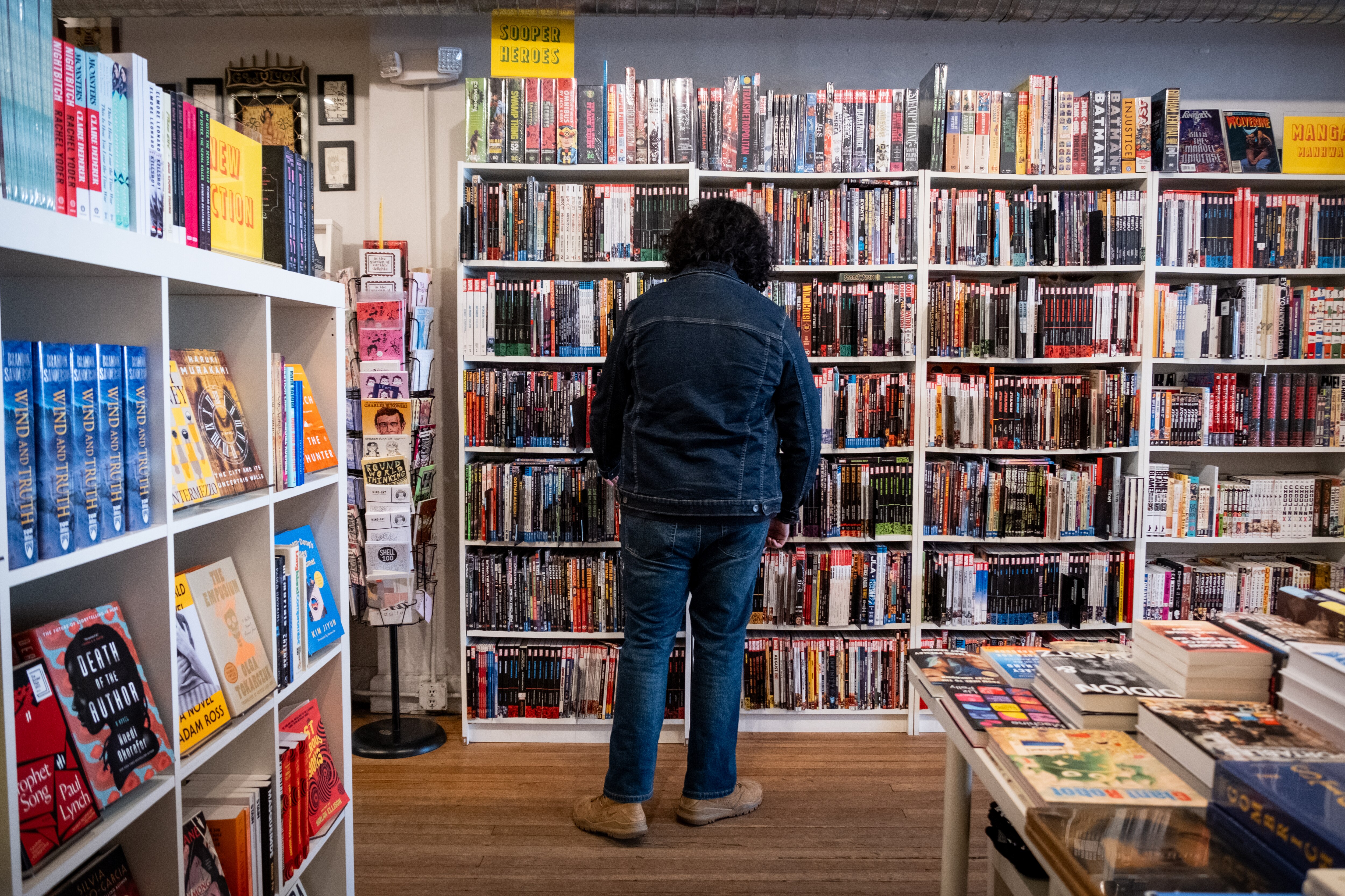 A customer shops at Atomic Books in Hampden on Friday, January 17, 2025.